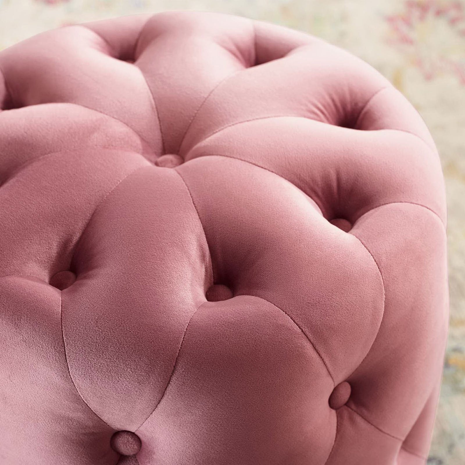 Dusty rose velvet ottoman upholstery adds luxurious texture against the patterned rug and warm room decor. || EEI-3778-DUS || detail_room