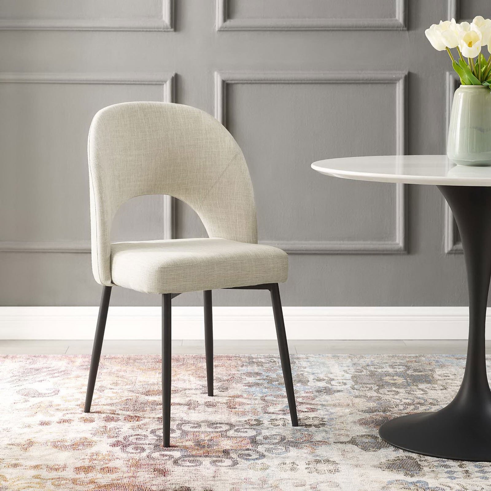 Rouse dining chair brings soft beige texture and sleek black legs to a modern dining room || EEI-3801-BLK-BEI || front_angle_room