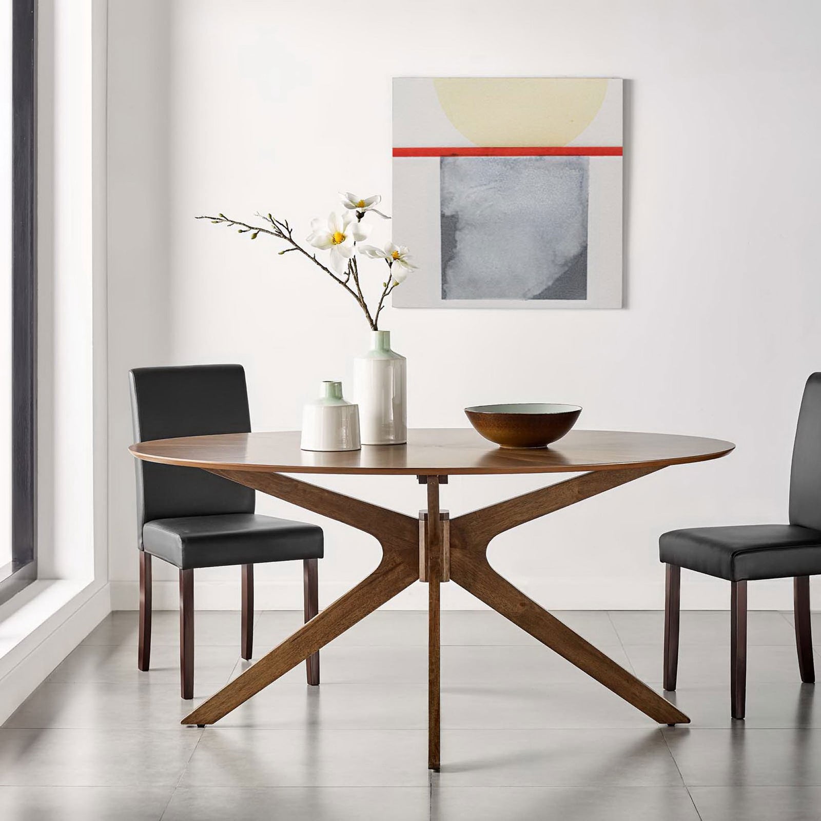 Walnut oval dining table anchors a bright minimalist dining space with upholstered chairs and wall art || EEI-3848-WAL || front_room