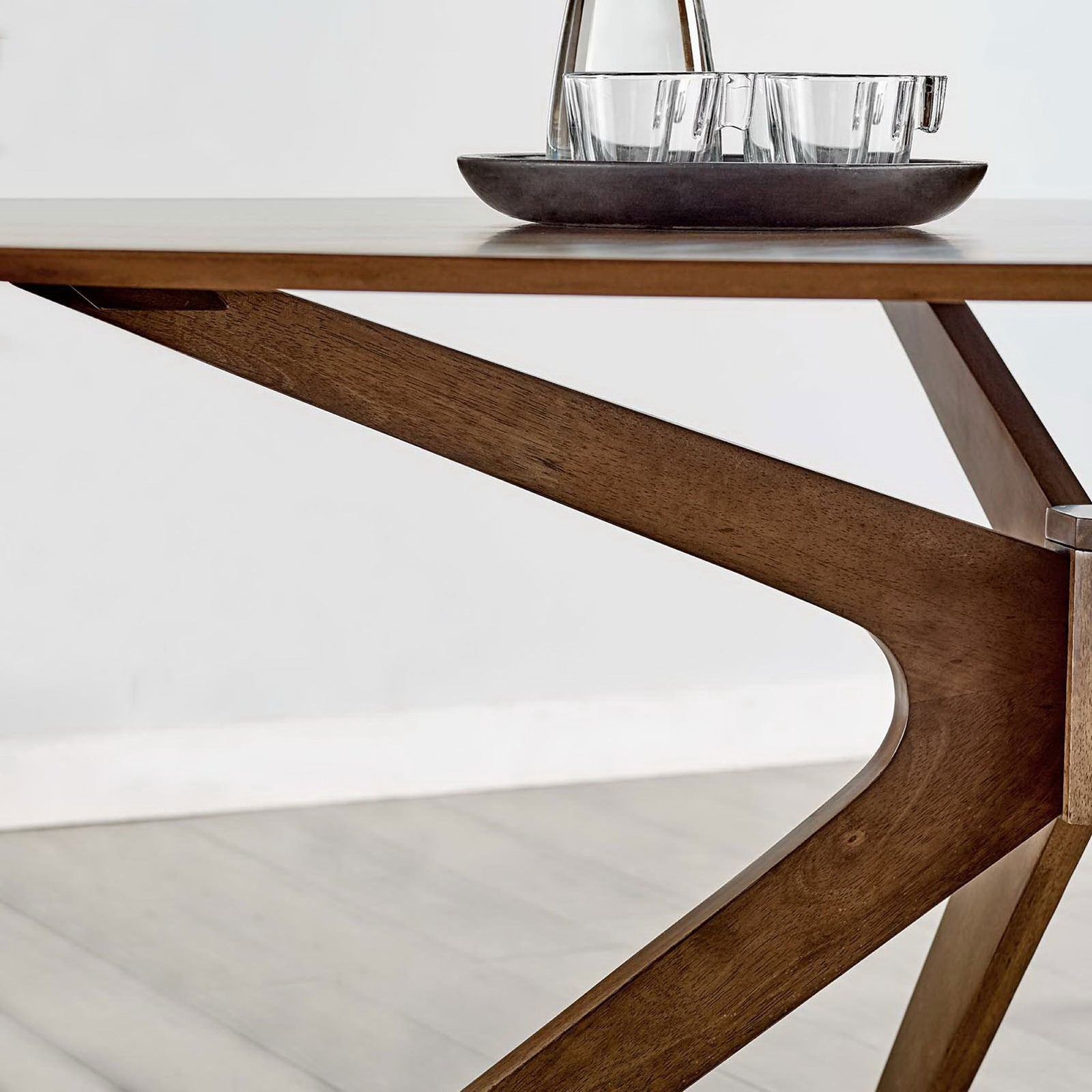 Walnut oval dining table pairs with leather look chairs to create a warm contemporary dining setting || EEI-3849-WAL || front_room