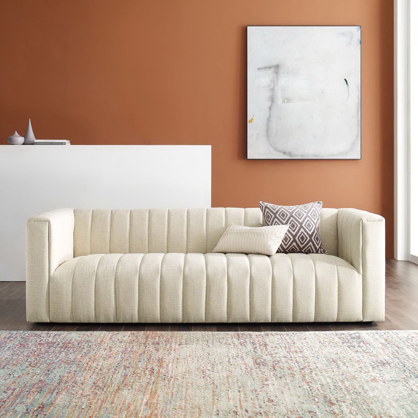 Beige channel tufted sofa styled in a modern living room with accent pillows and contemporary decor || EEI-3881-BEI || front_room