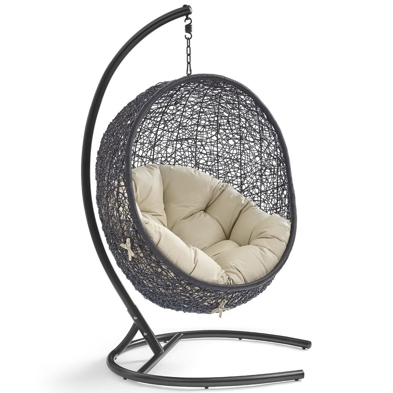 Open-weave rattan pod chair with plush beige Sunbrella cushion on curved espresso stand || EEI-3943-BLK-BEI || front_angle_studio