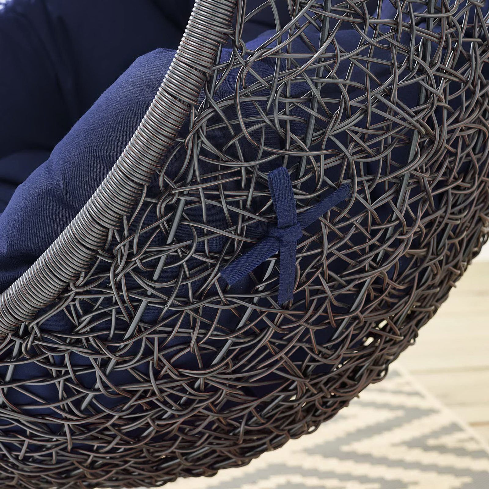 Detail of navy cushion tie and rattan weave showing refined finishing on outdoor egg chair || EEI-3943-BLK-NAV || detail_room