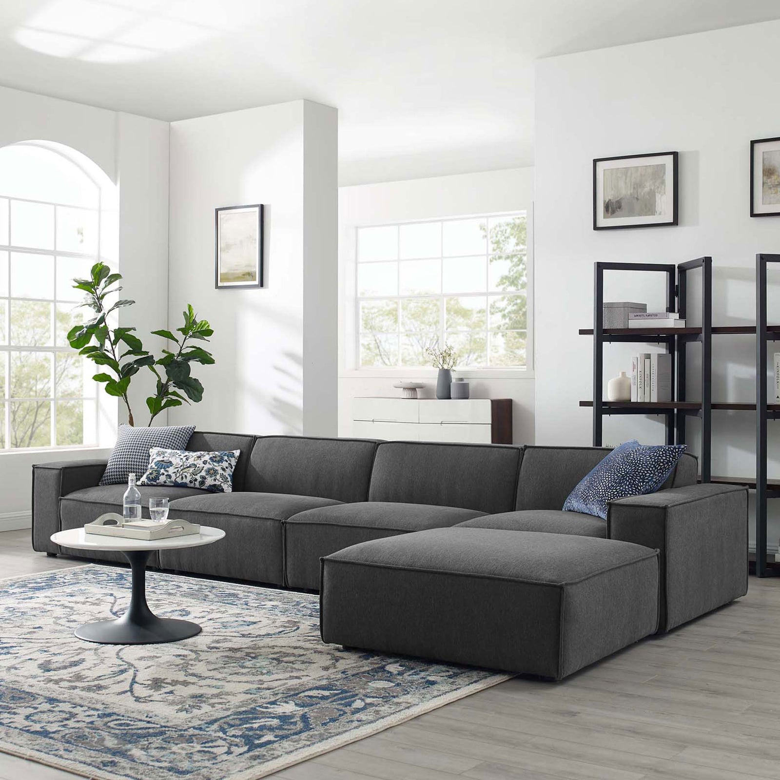 Charcoal Restore sectional sofa styled in a bright modern living room with rug and decor || EEI-4115-CHA || front_angle_room