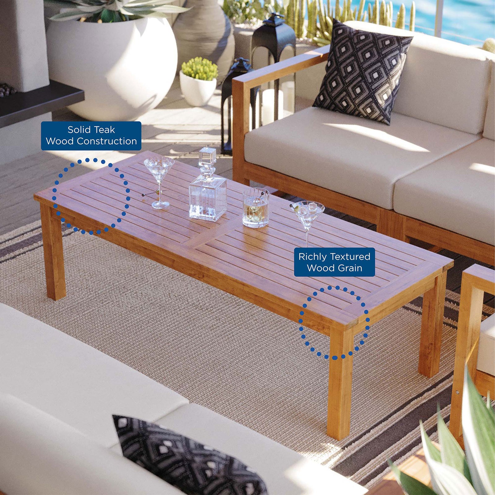 Long slatted teak coffee table on a coastal patio, emphasizing solid wood construction and richly textured grain || EEI-4122-NAT || callout_room