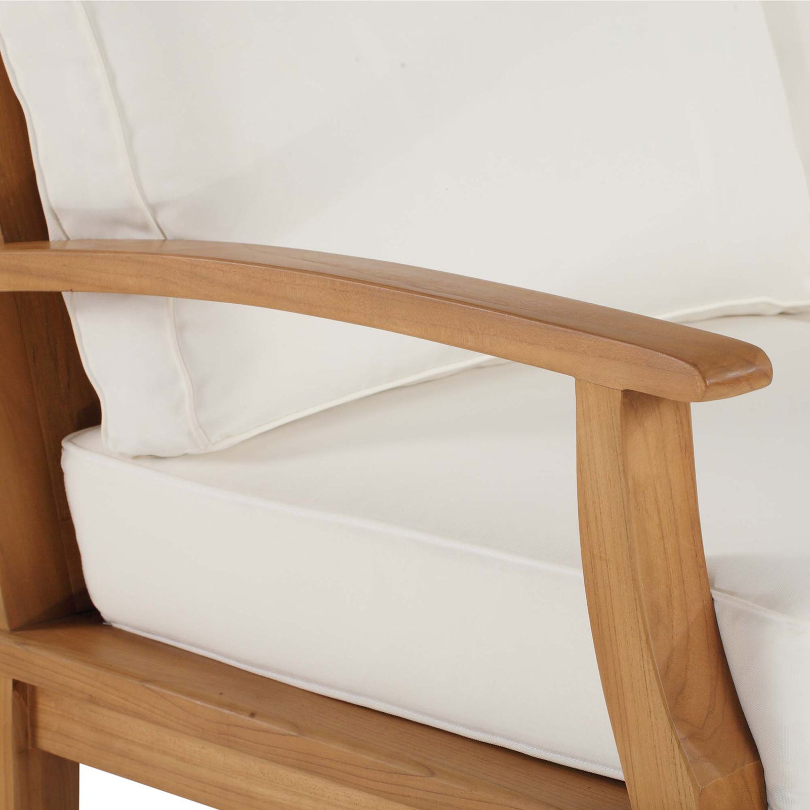 Smooth teak armrest and tailored white cushions highlight the sofa's refined outdoor craftsmanship || EEI-4176-NAT-WHI || detail_studio