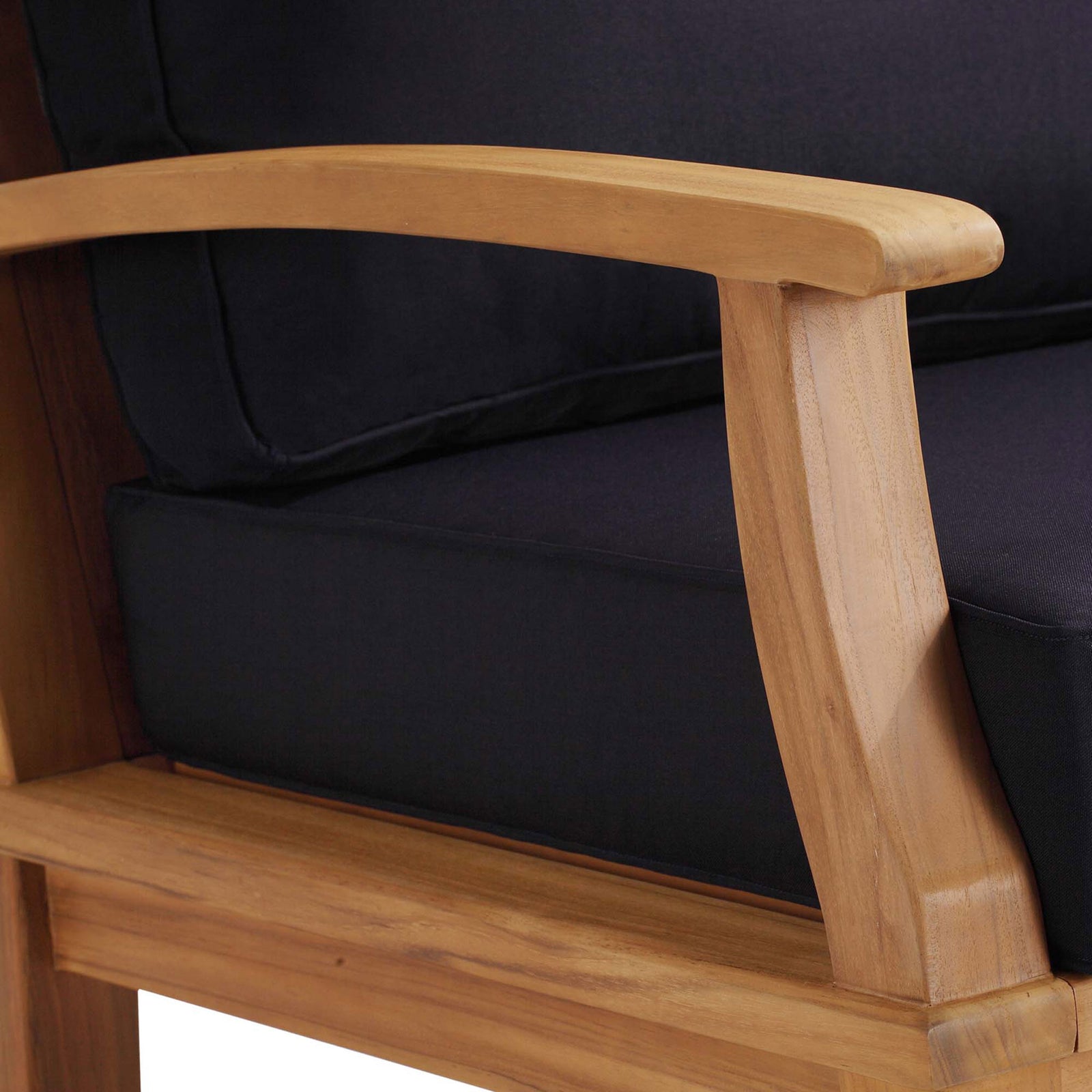Close up of Marina rocking chair armrest highlighting smooth teak finish and tailored navy upholstery || EEI-4177-NAT-NAV || detail_studio
