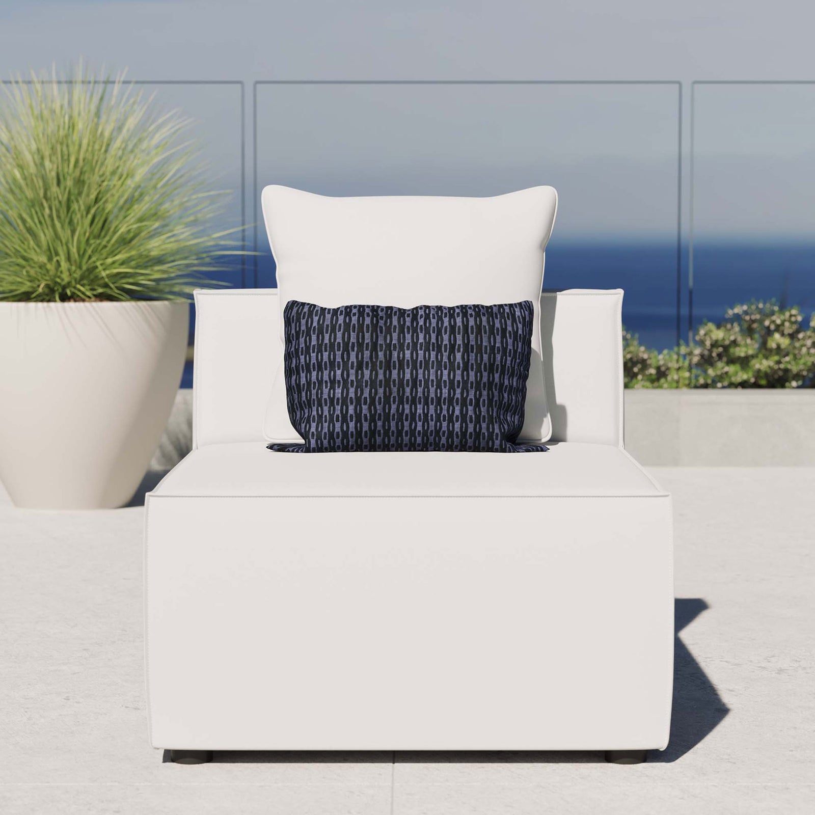 White outdoor armless sectional chair styled on a sunny patio with ocean view and plush cushion comfort || EEI-4209-WHI || front_room