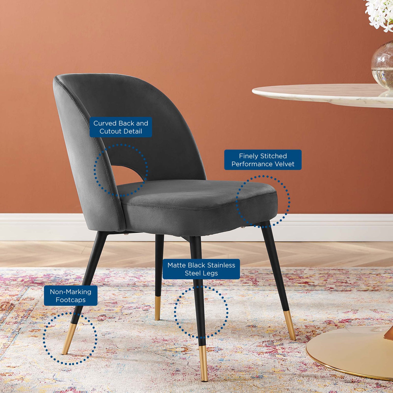 Charcoal velvet dining chair showcasing curved back, cutout detail, and matte black metal legs. || EEI-4212-CHA || callout_room