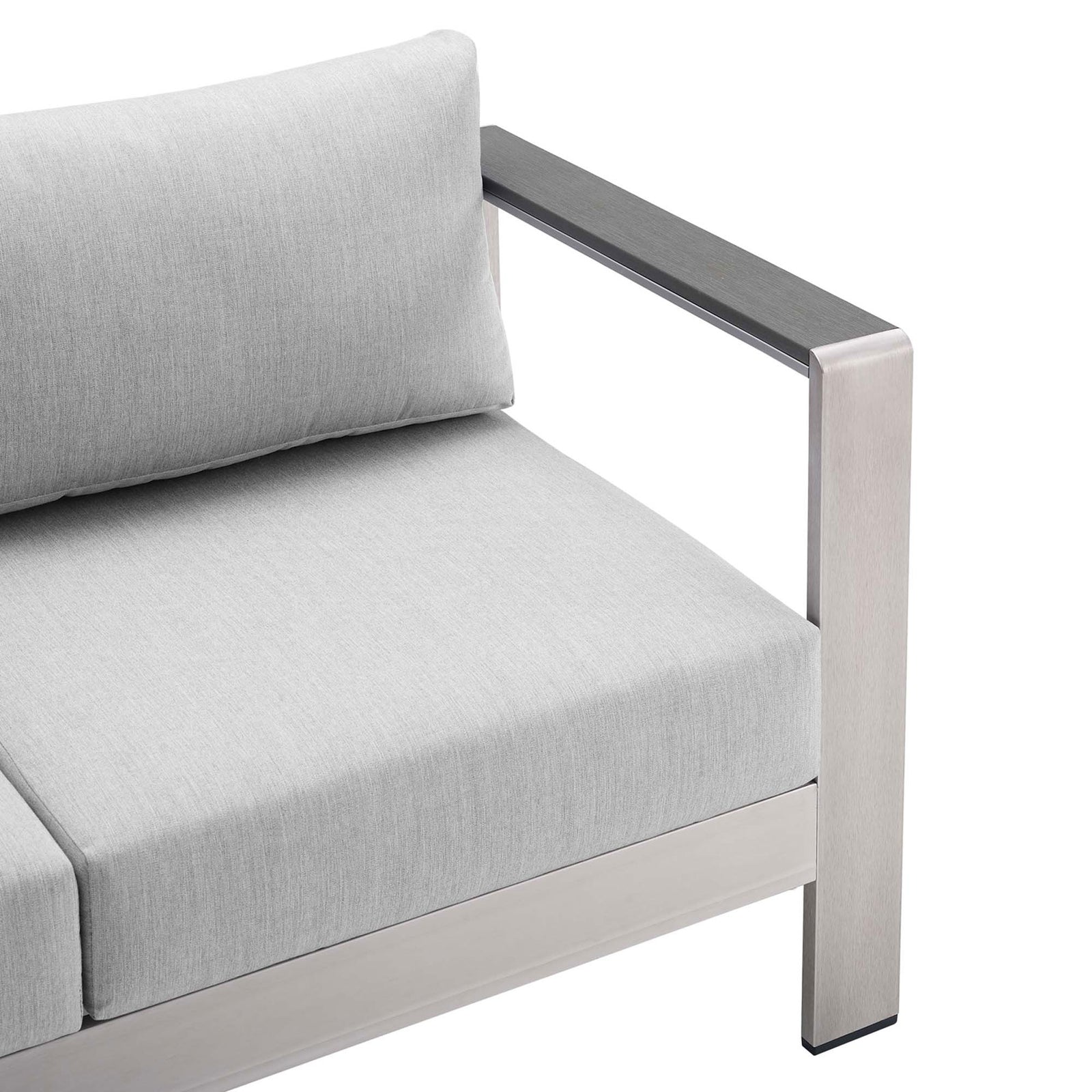 Close-up of loveseat arm showing brushed aluminum frame and tailored light gray cushion seam || EEI-4226-SLV-GRY || detail_studio