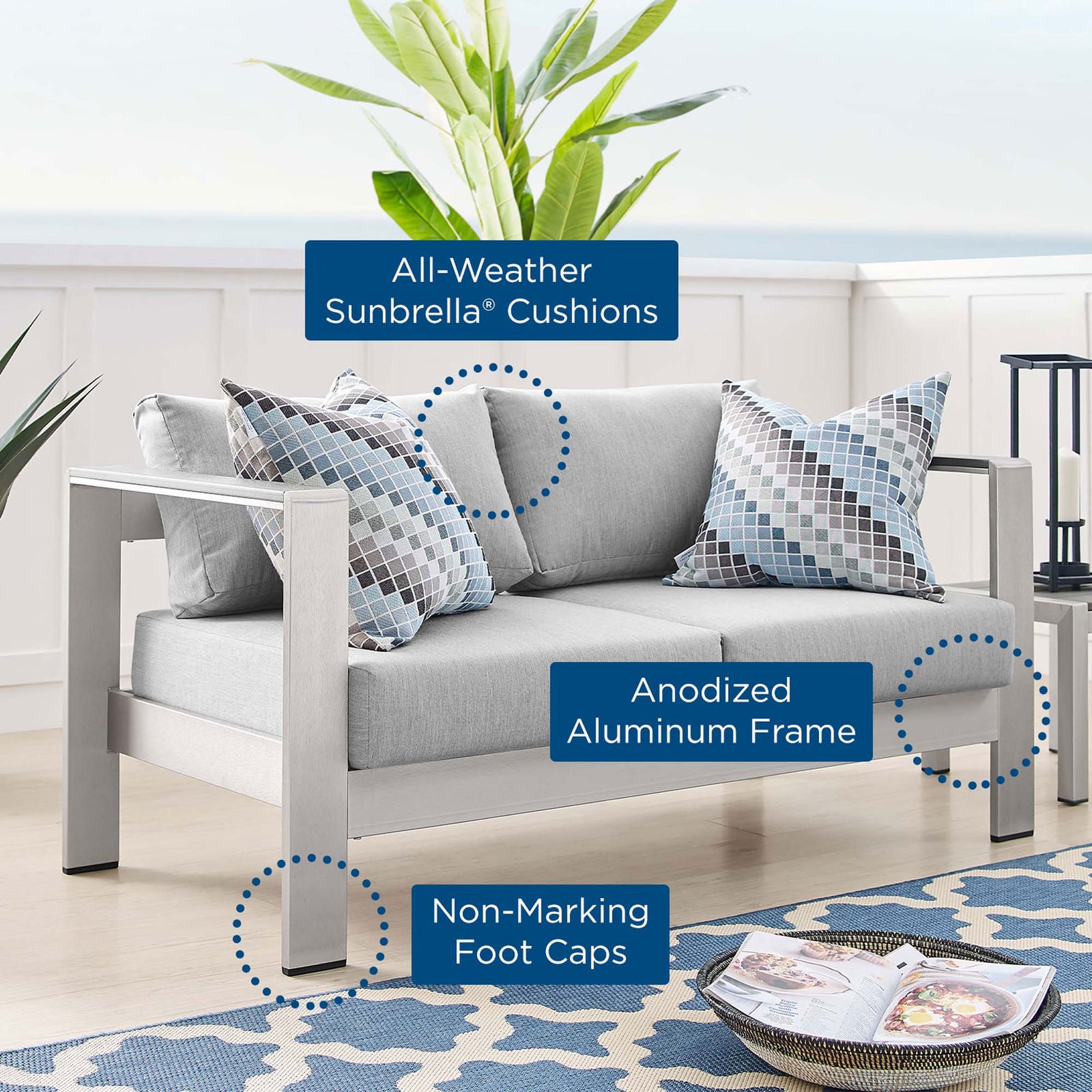 Sunbrella cushions, anodized aluminum frame, and non-marking foot caps highlighted with callouts on loveseat || EEI-4226-SLV-GRY || callout_room
