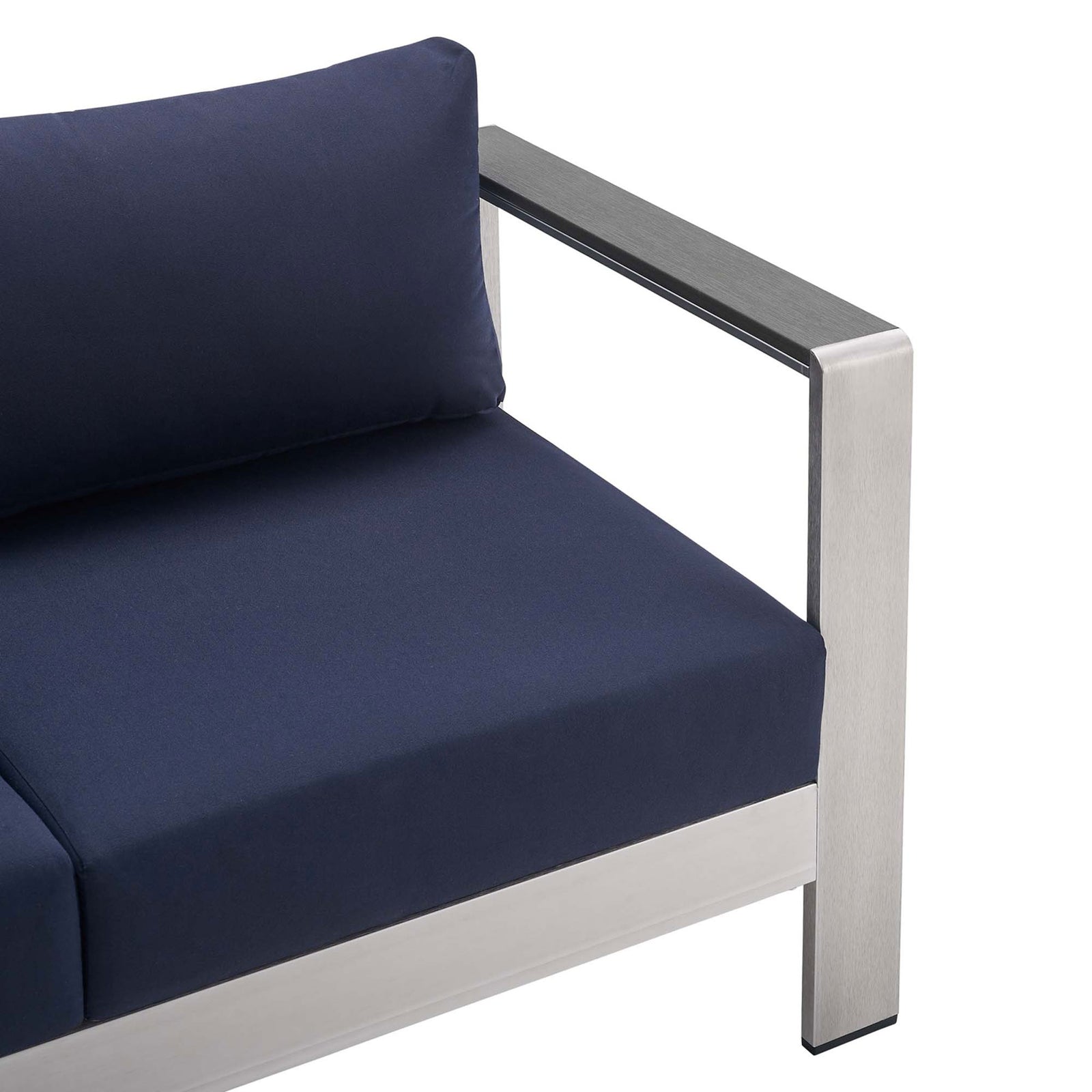 Close-up of loveseat arm showing brushed aluminum frame and tailored navy cushion seam || EEI-4226-SLV-NAV || detail_studio