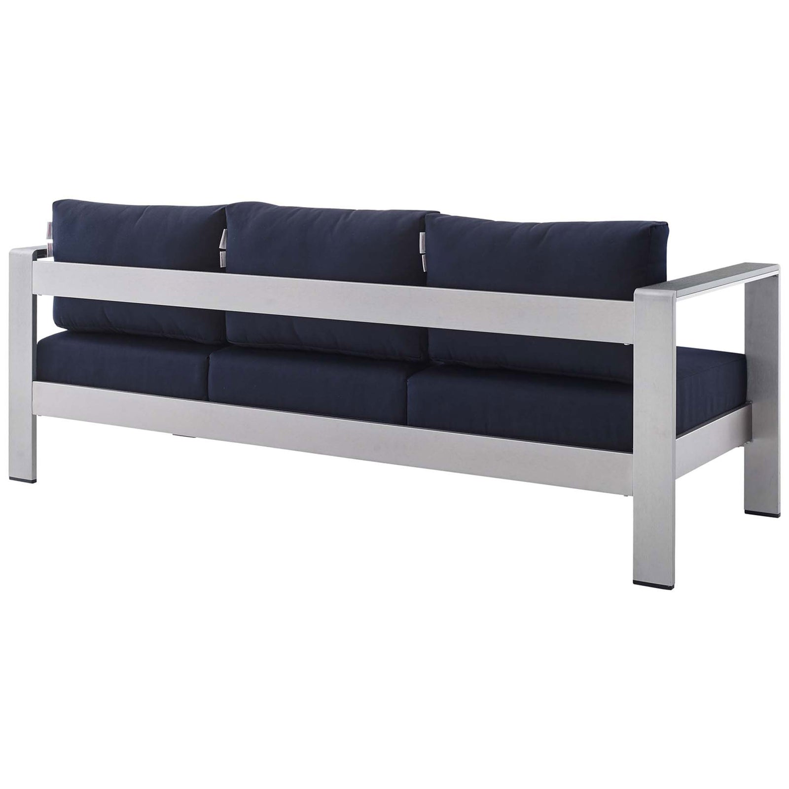 Continuous aluminum back rail supports three tailored navy Sunbrella cushions || EEI-4228-SLV-NAV || back_angle_studio