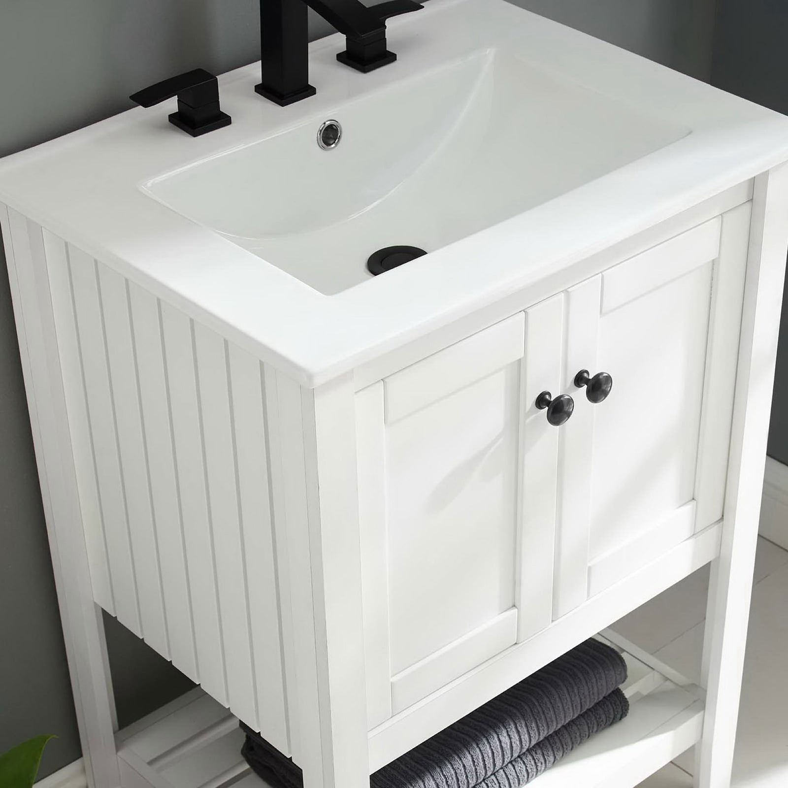 Fresh white finish brightens the bath with practical storage and a sleek sink || EEI-4246-WHI-WHI || front_angle_room