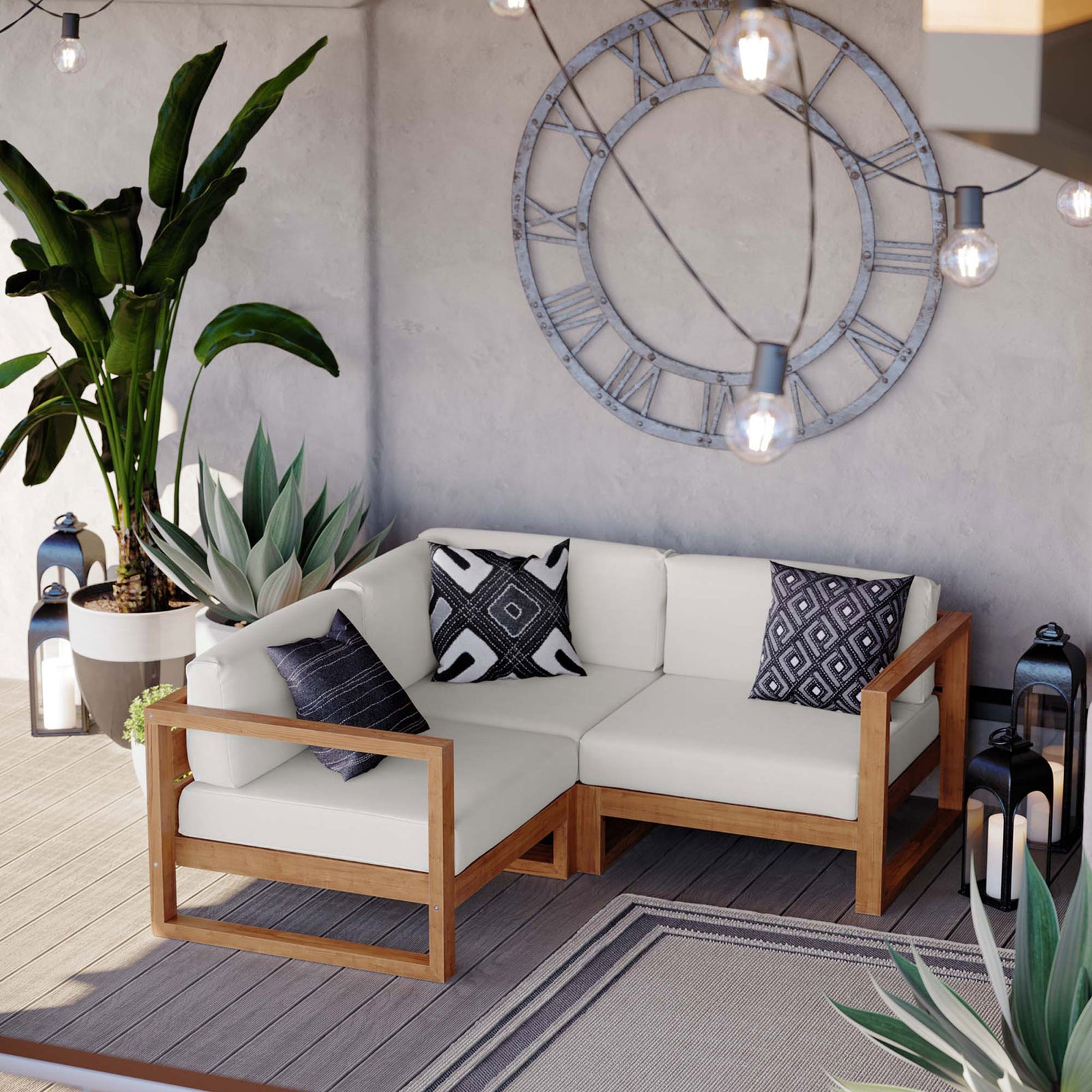 Cozy outdoor corner with teak sectional, lush plants, lanterns, and string lights for relaxed evenings || EEI-4255-NAT-WHI-SET || front_angle_room