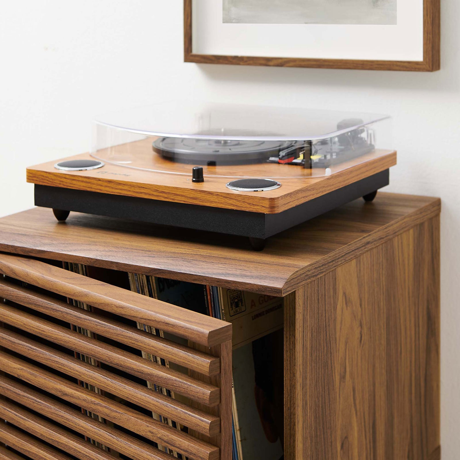 Turntable resting on walnut record stand top, showing spacious surface and rich wood grain || EEI-4262-WAL || detail_open_room