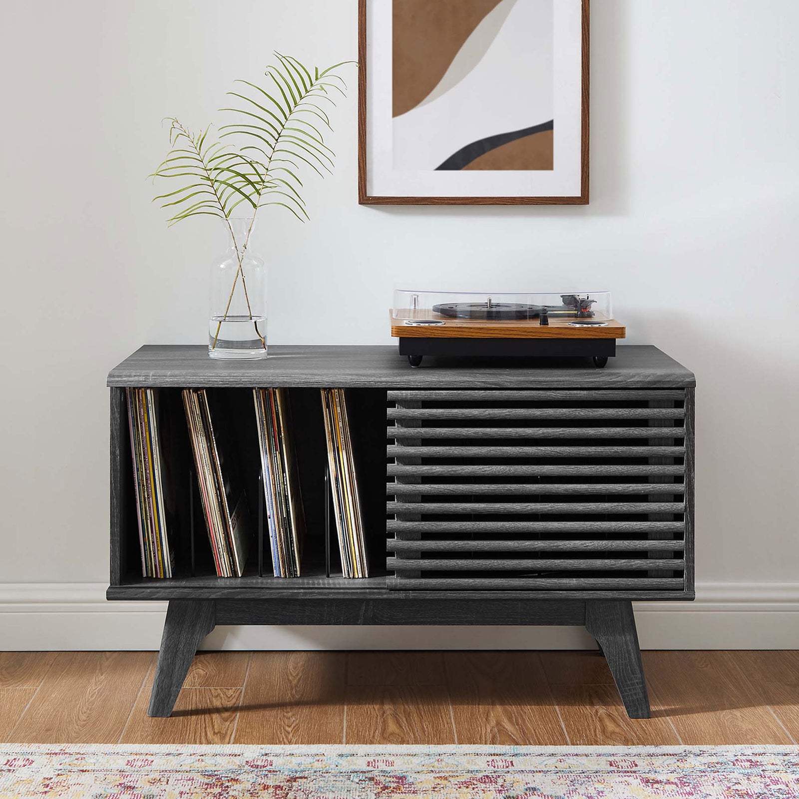 Charcoal record stand styled in a modern living room with albums displayed and turntable on top. || EEI-4263-CHA || front_open_room