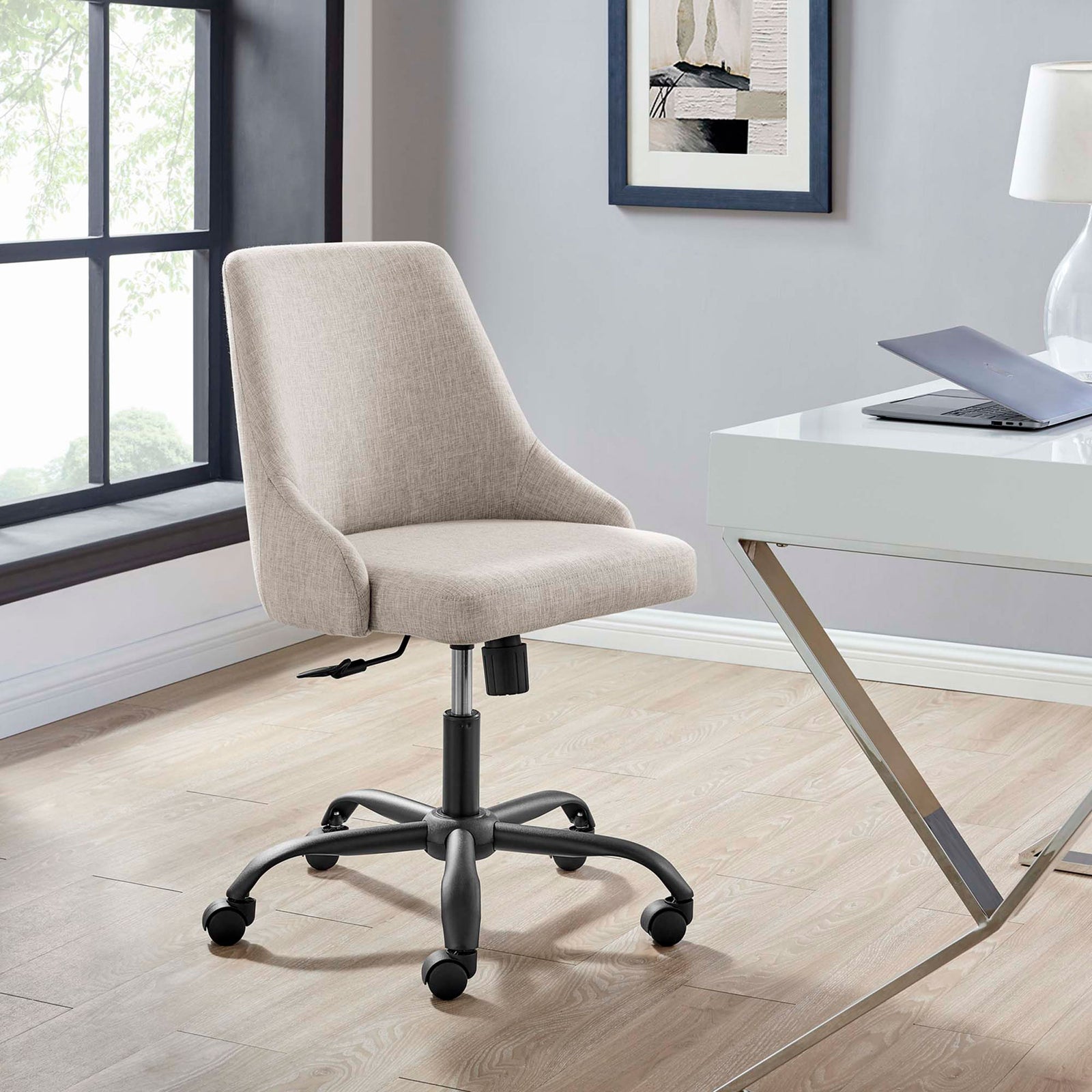 Beige swivel office chair with fabric upholstery and black base styled beside a modern white writing desk || EEI-4371-BLK-BEI || front_angle_room