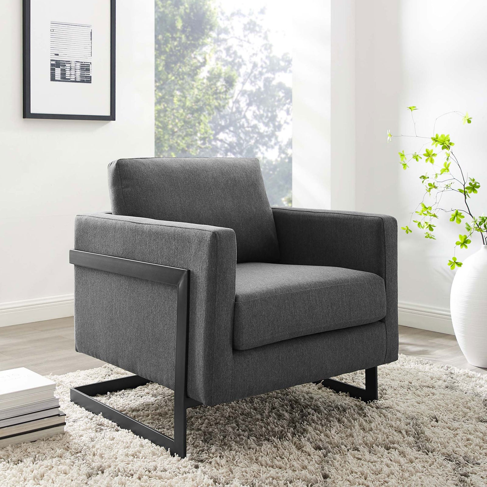 Modern lounge chair anchors the room with charcoal upholstery and a sculptural matte black base || EEI-4391-BLK-CHA || front_angle_room