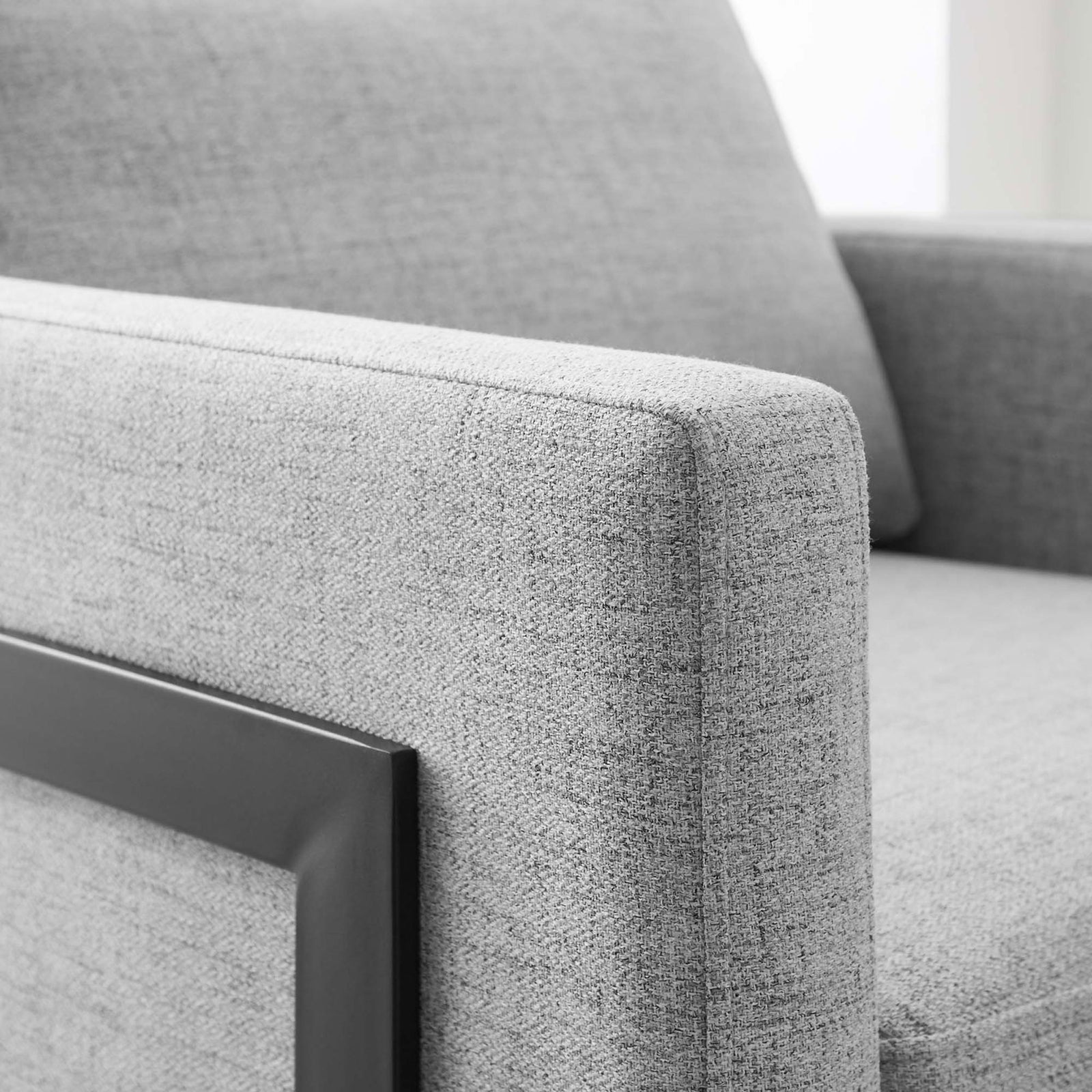 Smooth, tailored arm and supportive cushion highlight the chair's refined comfort. || EEI-4391-BLK-LGR || detail_room