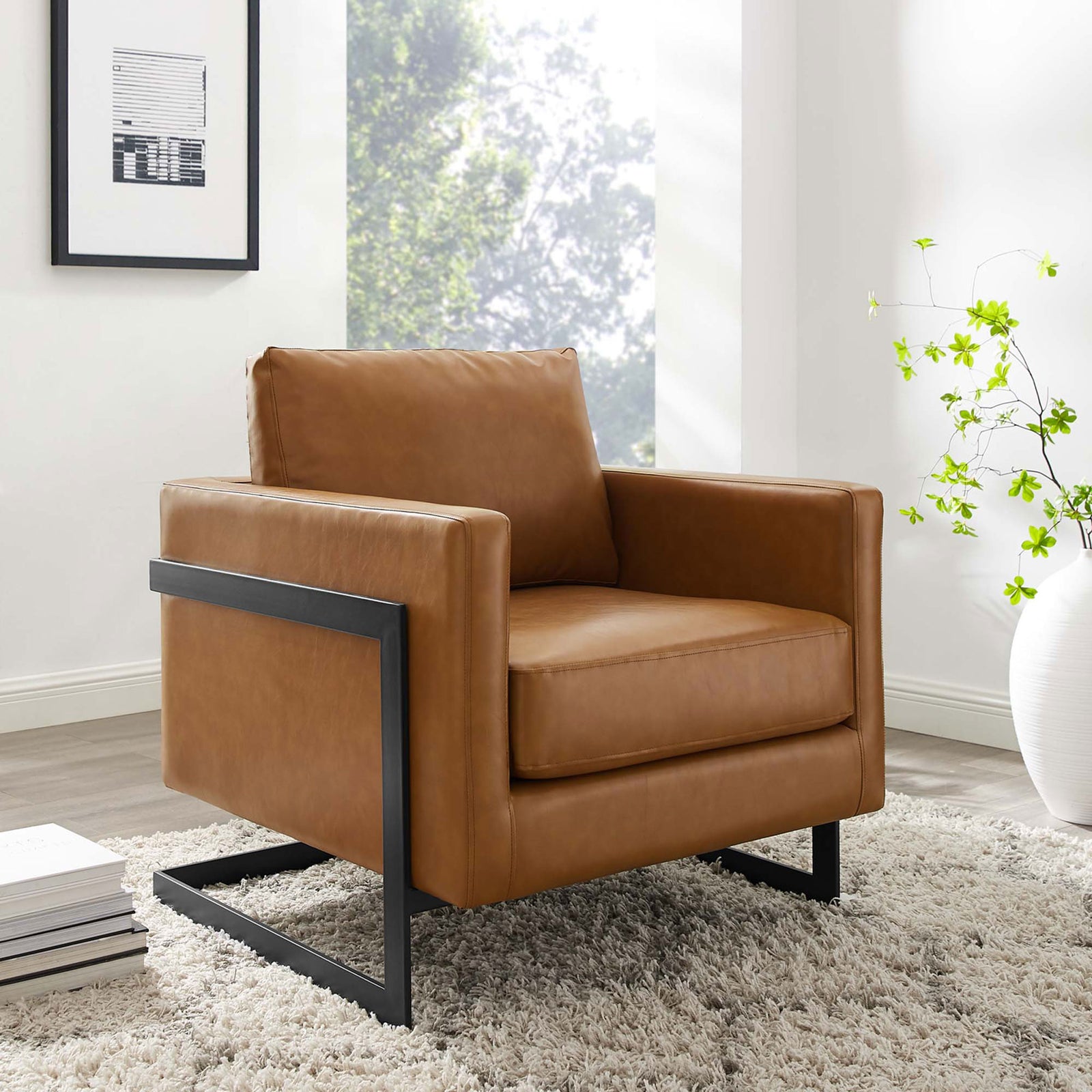 Modern accent chair in tan vegan leather with deep cushioning and a crisp black sled base || EEI-4392-BLK-TAN || front_angle_room