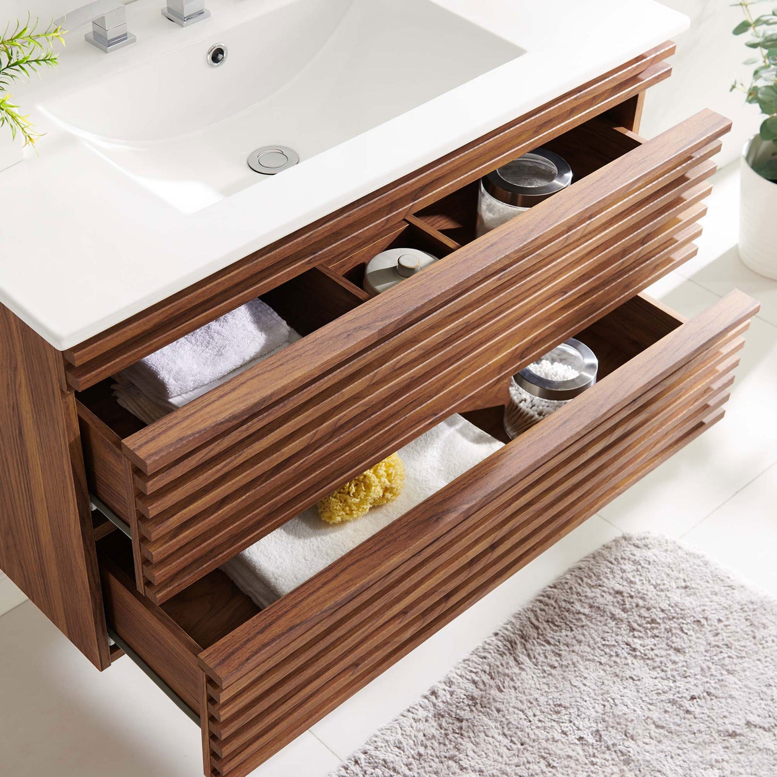 Roomy drawers glide smoothly to store towels and accessories in this floating 36-inch vanity. || EEI-4436-WAL-WHI || storage_open_room