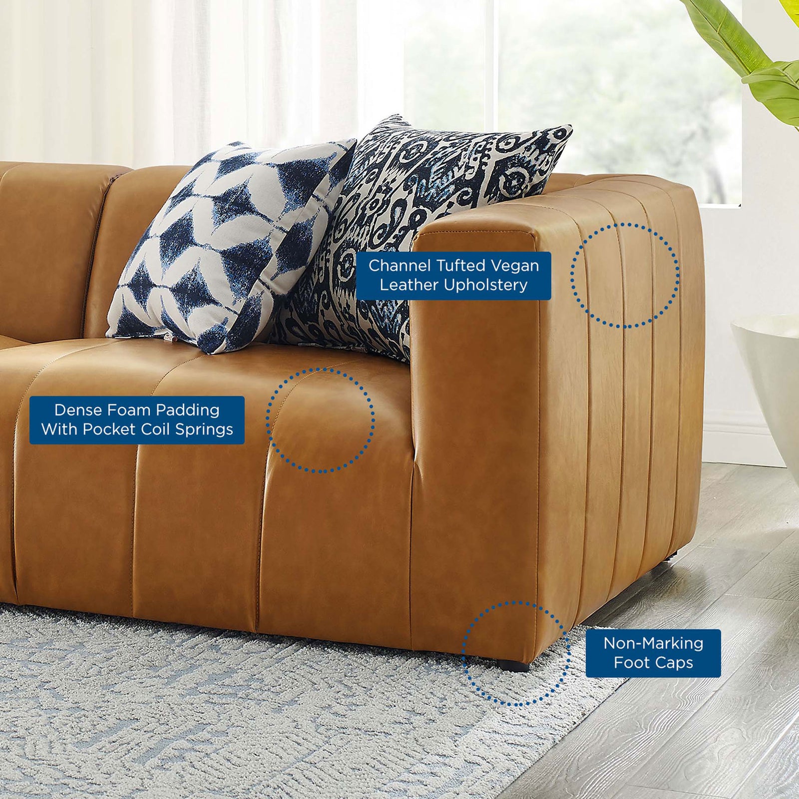 Bartlett tan vegan leather sofa in a living room with callouts for comfort, support, and protective foot caps || EEI-4515-TAN || callout_room