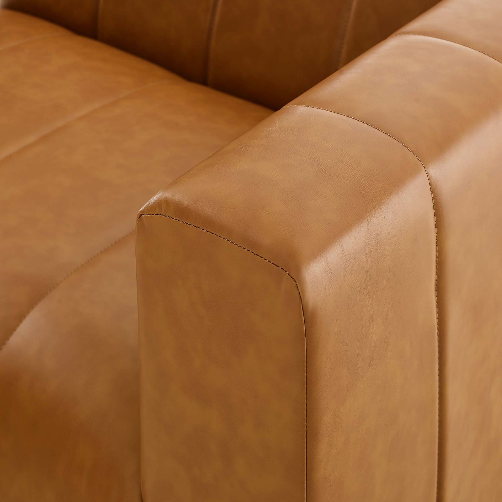 Tan vegan leather upholstery detail showing soft, supple texture and precise tailored stitching || EEI-4515-TAN || detail_studio