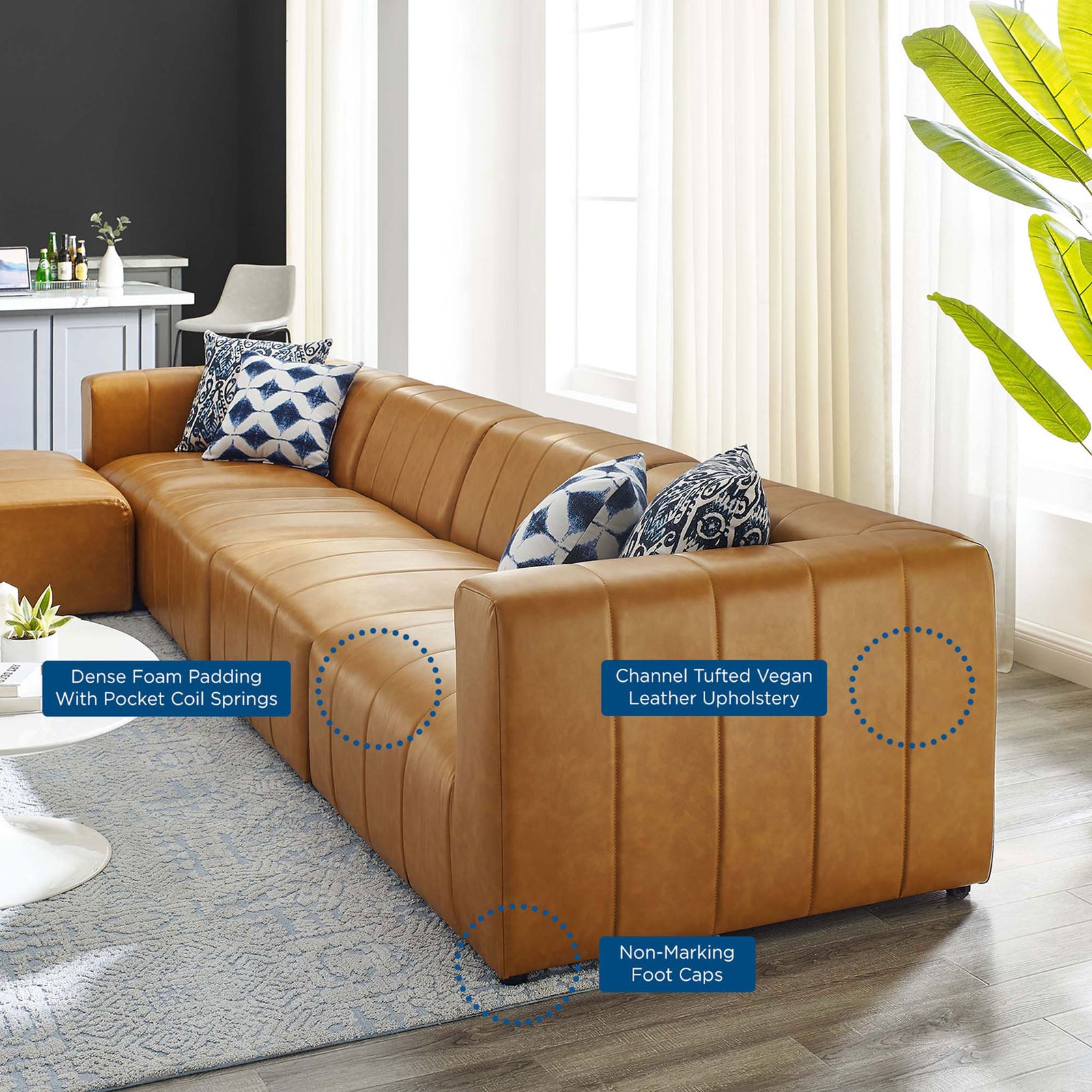 Room view of Bartlett tan vegan leather sectional with feature callouts for comfort and care || EEI-4521-TAN || callout_room