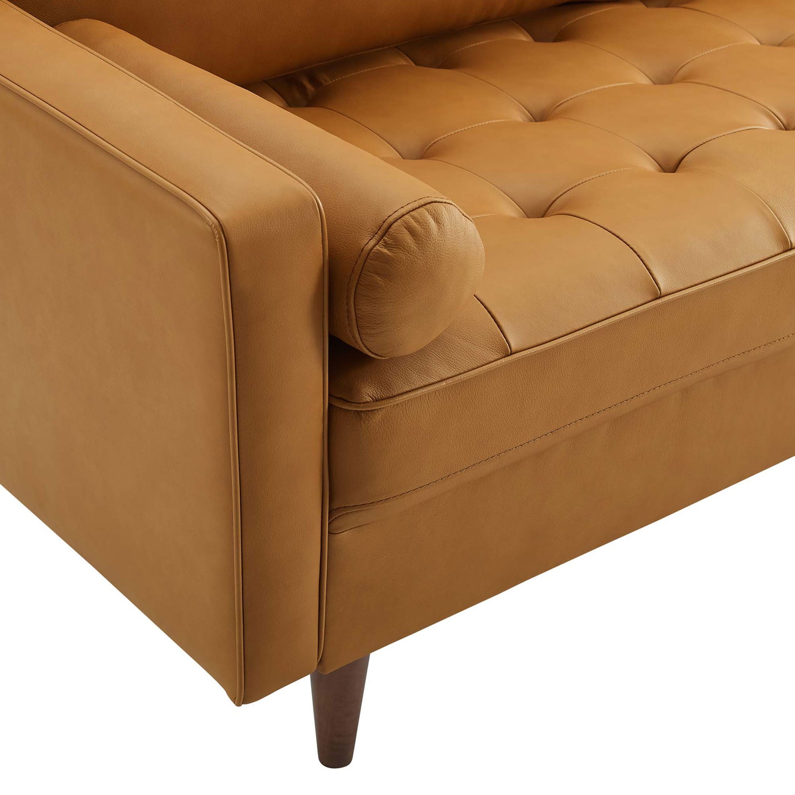 Tan leather sofa arm with round bolster pillow and biscuit-tufted seat || EEI-4633-TAN || detail_studio