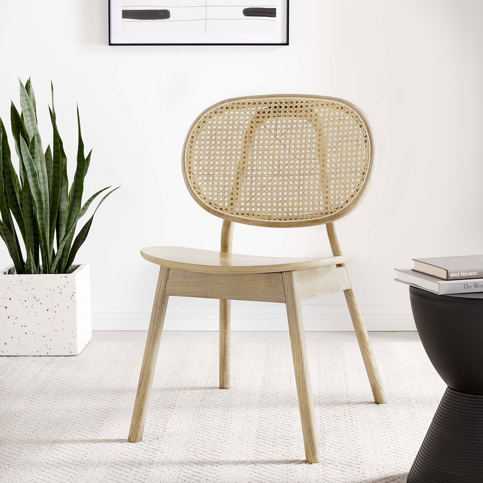 Wood dining chair with cane back creating a breezy focal point in a bright, modern living space || EEI-4649-GRY || front_angle_room