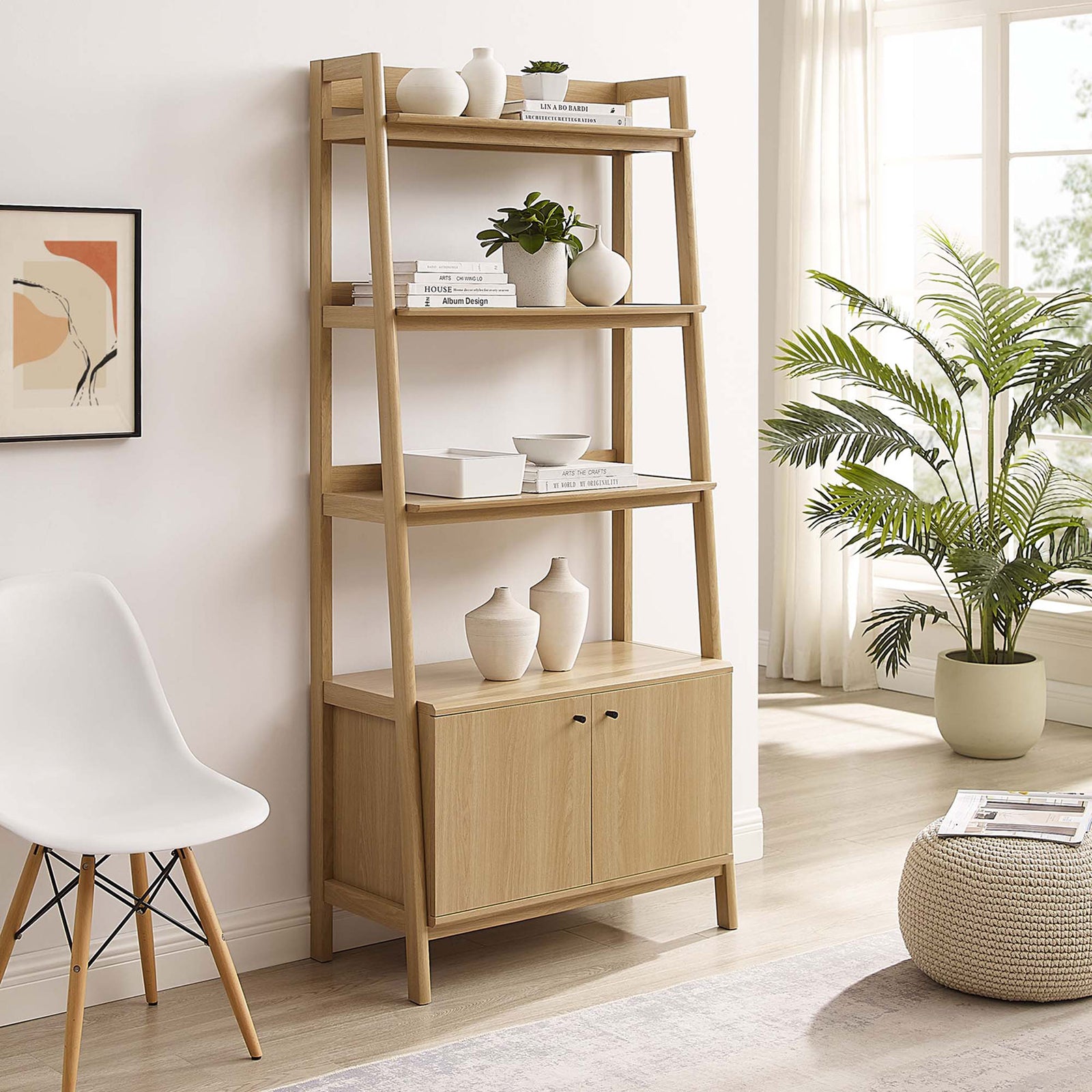 Warm oak finish and clean silhouette elevate any room, with generous display space and hidden storage below || EEI-4656-OAK || front_angle_room