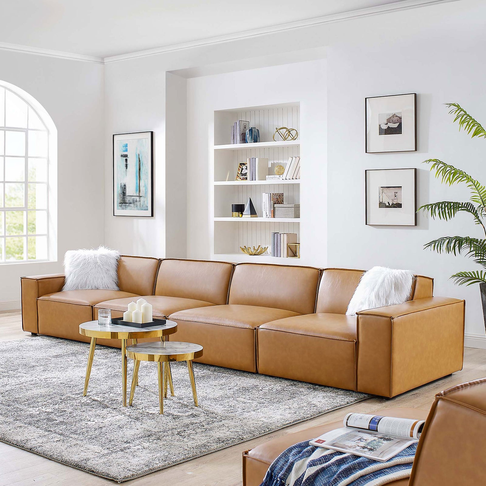 Restore tan vegan leather modular sofa styled in a bright living room with modern decor || EEI-4710-TAN || front_angle_room