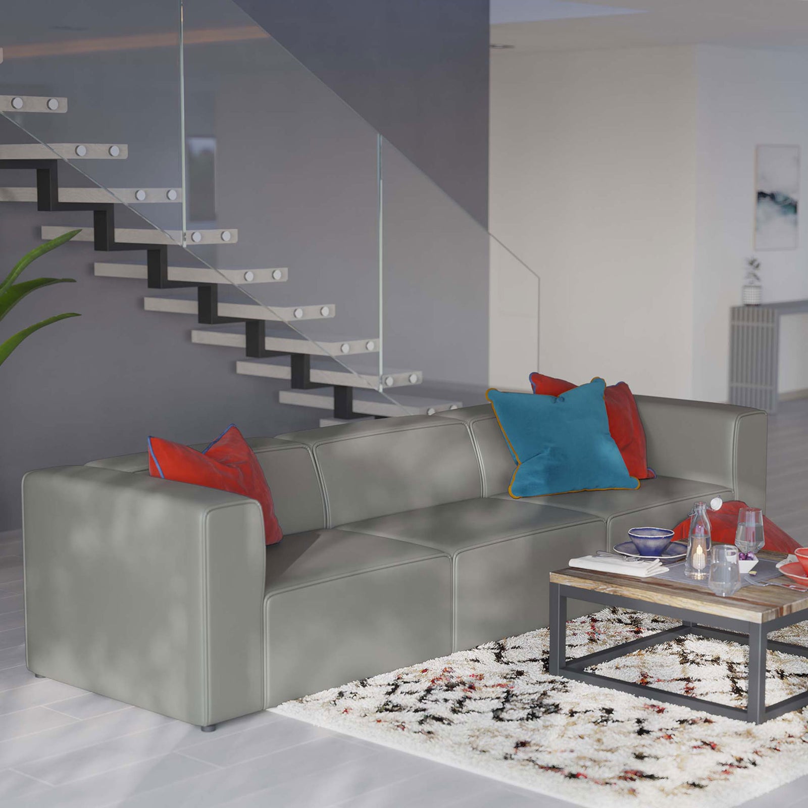 Gray vegan leather sectional styled with colorful pillows in a bright open-concept living space || EEI-4789-GRY || front_angle_room