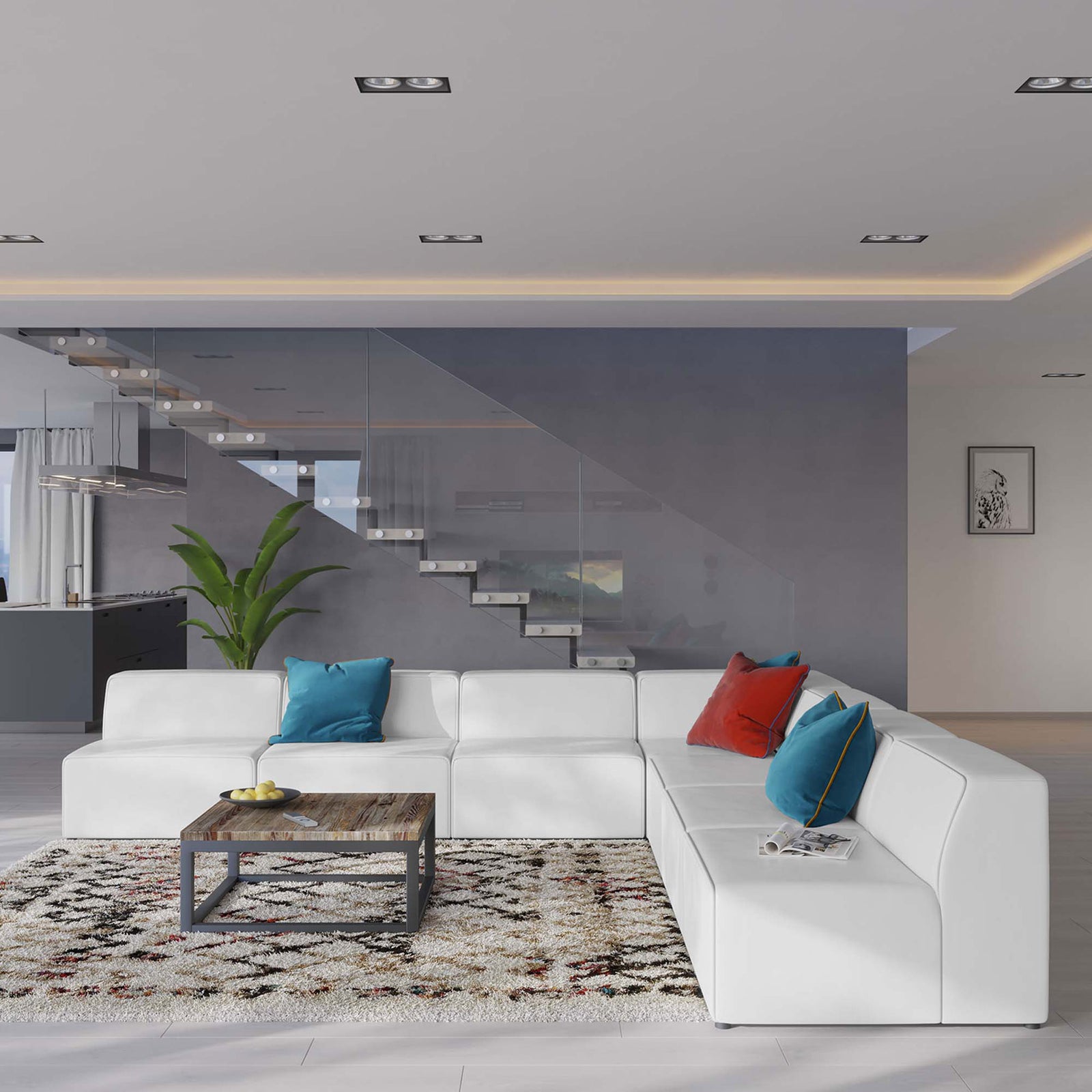Spacious white sectional anchors a bright open-plan living area with colorful pillows and a modern coffee table || EEI-4797-WHI || front_angle_room