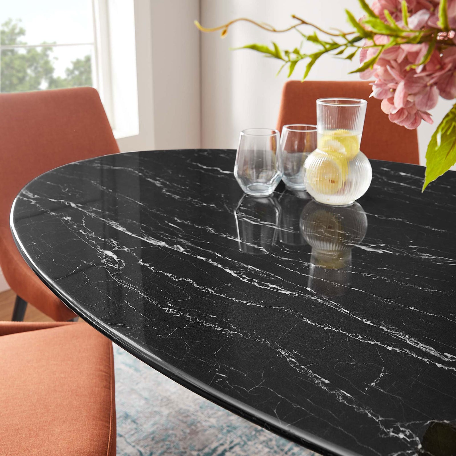Glossy black faux marble tabletop styled with glassware and flowers for welcoming everyday dining || EEI-4881-BLK-BLK || detail_room