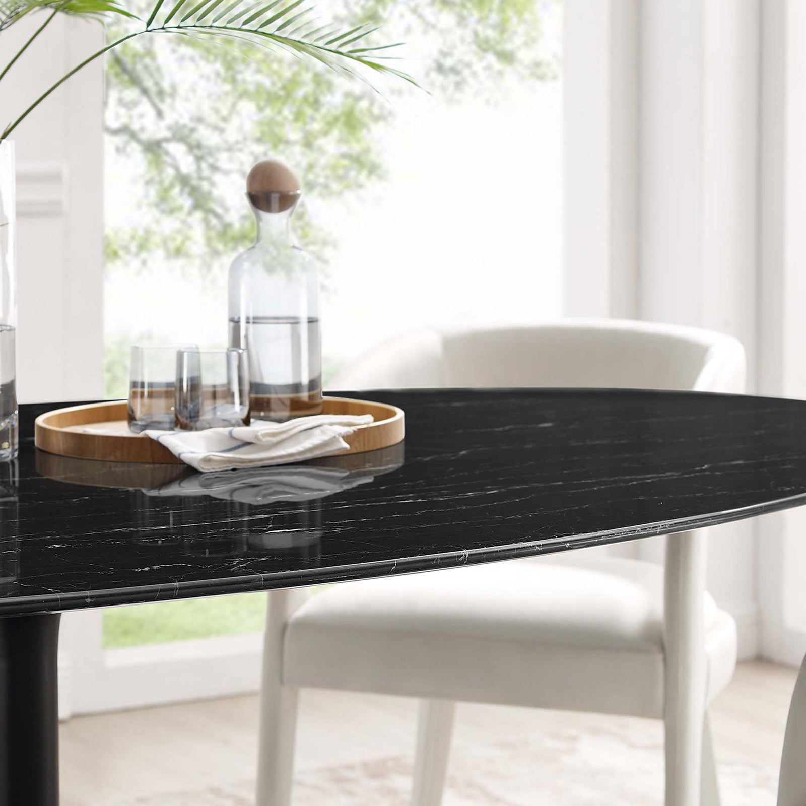 Faux marble tabletop styled with tray and glassware, adding refined texture to the dining space || EEI-4889-BLK-BLK || detail_room