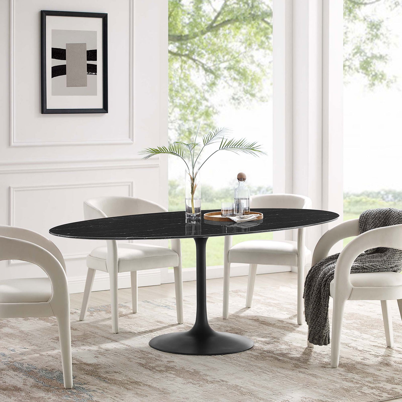 Black oval pedestal dining table with cream upholstered chairs in an airy contemporary room || EEI-4889-BLK-BLK || front_angle_room