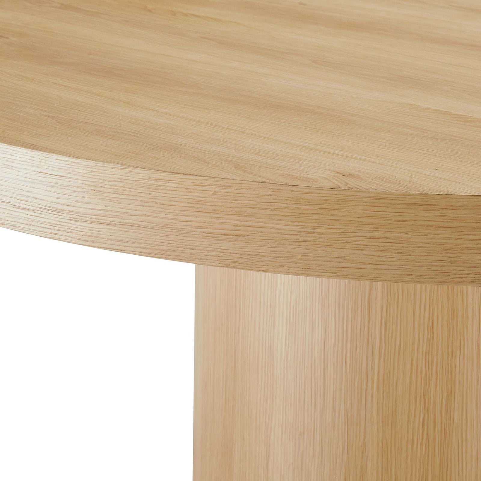 Warm oak veneer highlights the thick rounded tabletop profile and seamless cylindrical base connection || EEI-4911-OAK || detail_studio