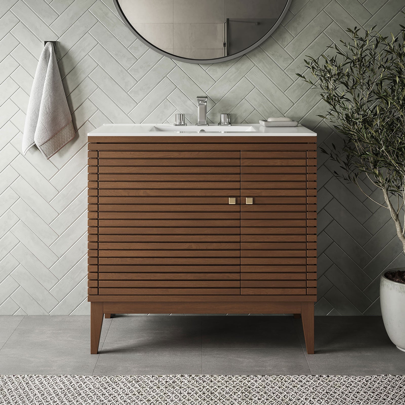 Contemporary bathroom setting frames a walnut slatted vanity with a clean white sink || EEI-5115-WAL-WHI || front_room