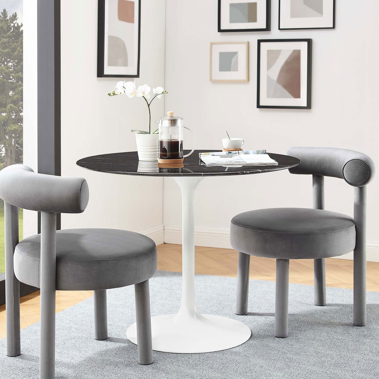 36 inch black faux marble dining table styled with two gray chairs in a bright modern nook || EEI-5168-WHI-BLK || front_room
