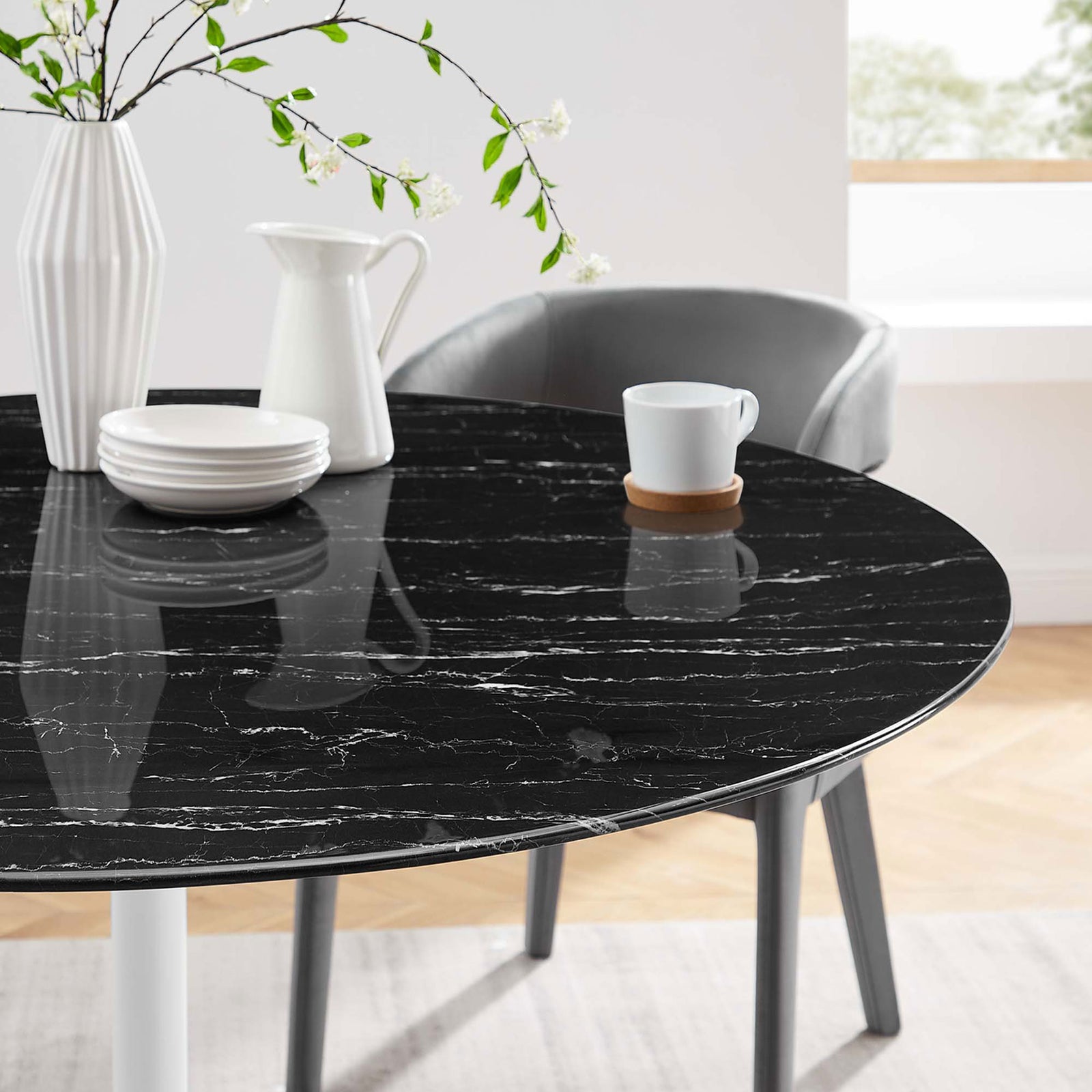 Black faux marble tabletop styled with white serveware and greenery for an elegant dining look || EEI-5183-WHI-BLK || detail_room