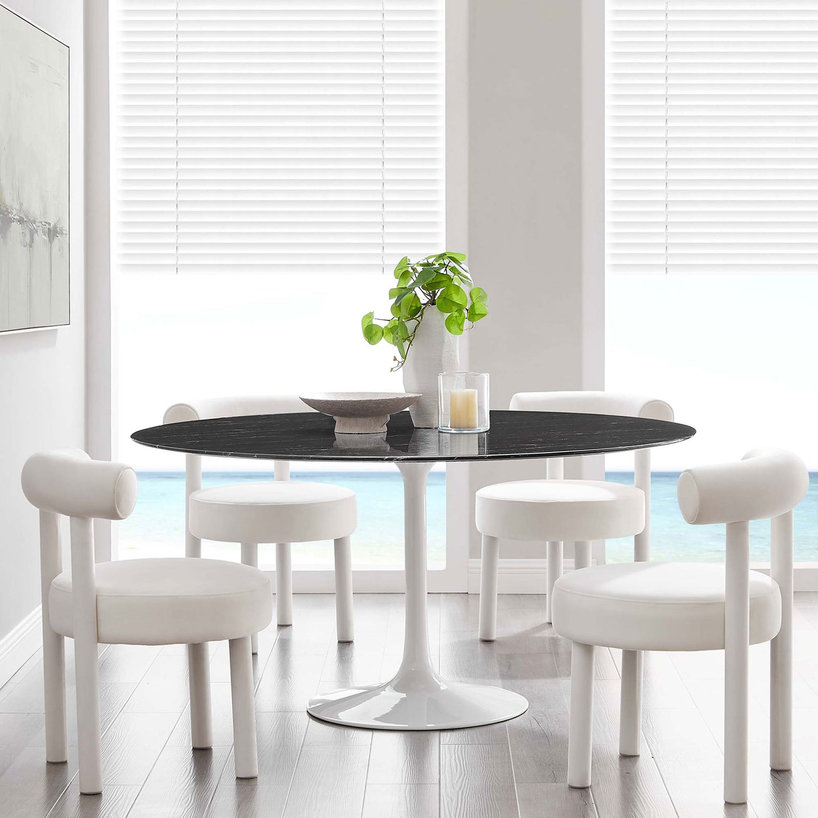 60 inch black faux marble dining table paired with white chairs in an airy coastal inspired room || EEI-5184-WHI-BLK || front_room
