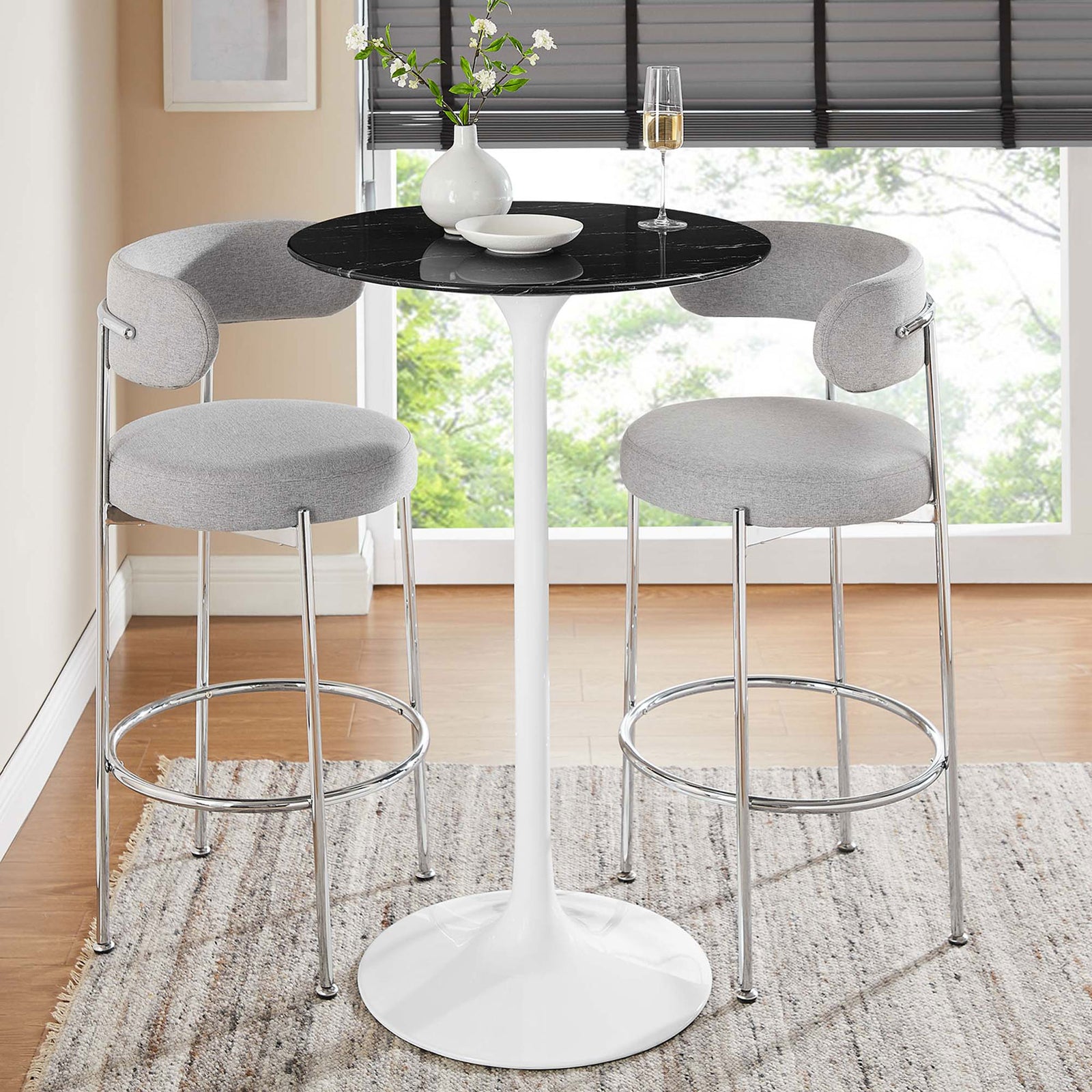 Bar-height pedestal table pairs a black faux marble top with a crisp white base for modern dining || EEI-5203-WHI-BLK || front_angle_room