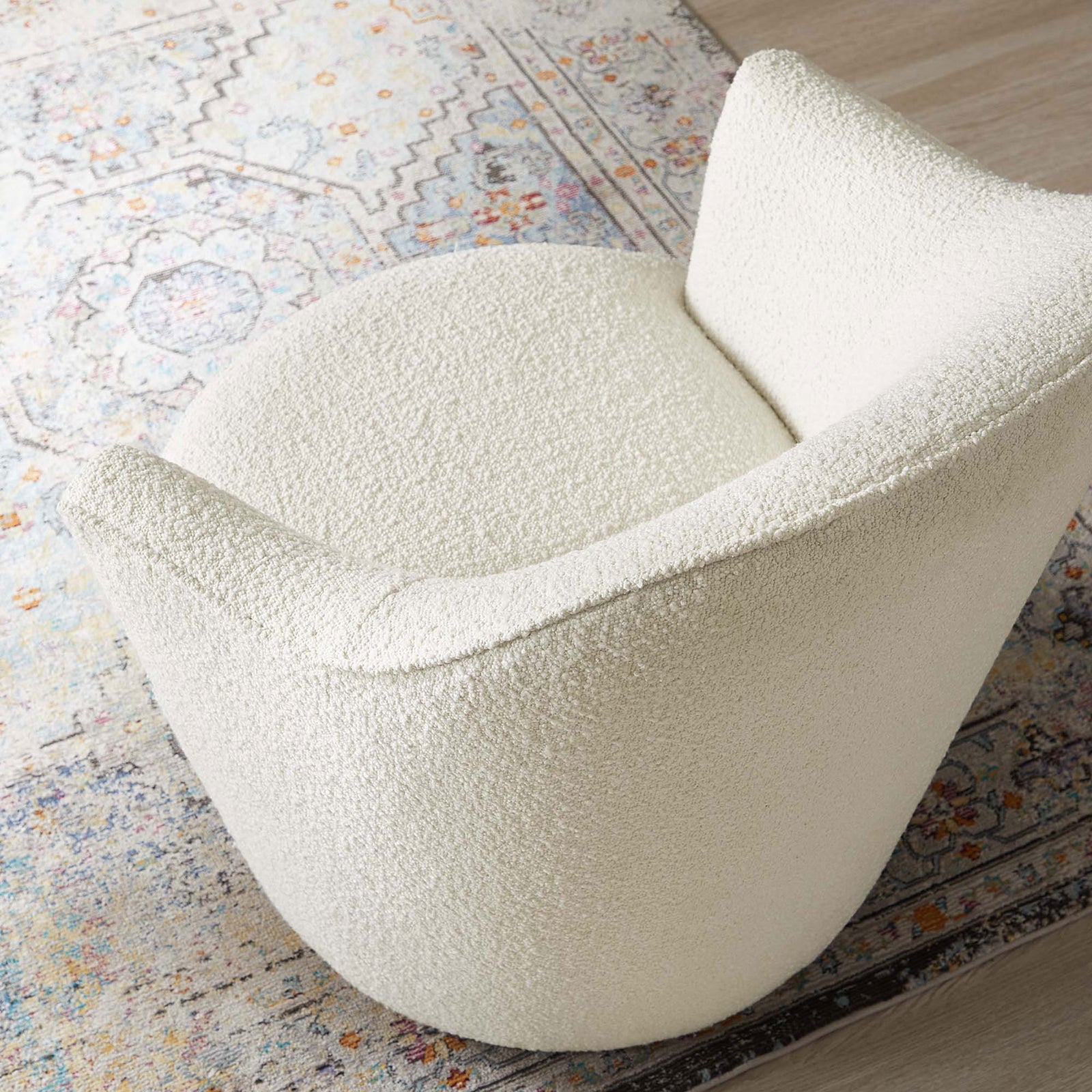 Rounded seat and contoured back cradle you in comfort with soft, tactile boucle || EEI-5311-WHI || detail_room