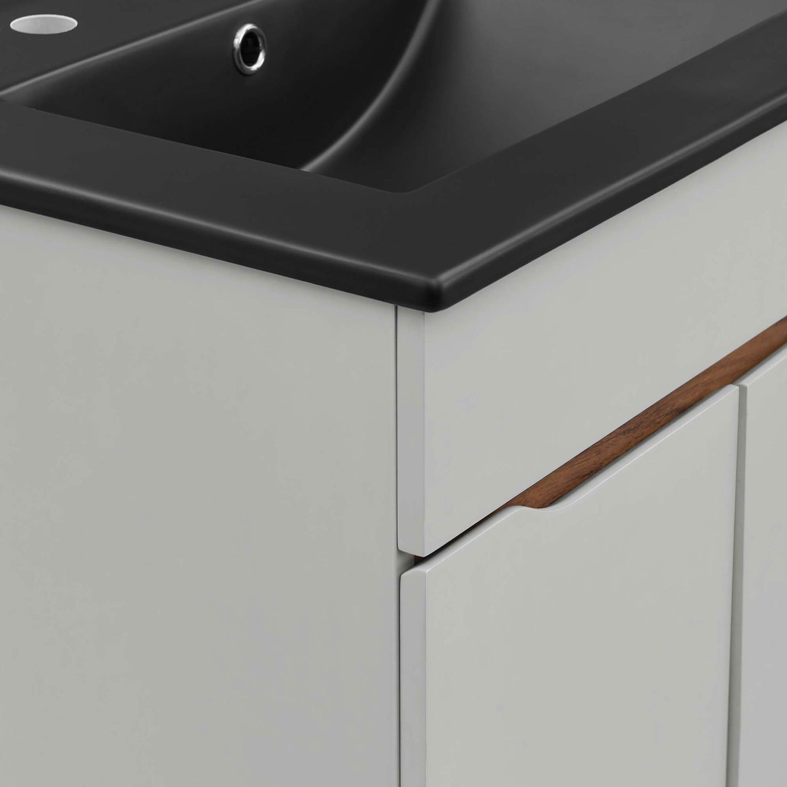 Rounded basin edge and wood-accented cutout pull provide refined texture and contrast || EEI-5357-GRY-BLK || detail_studio