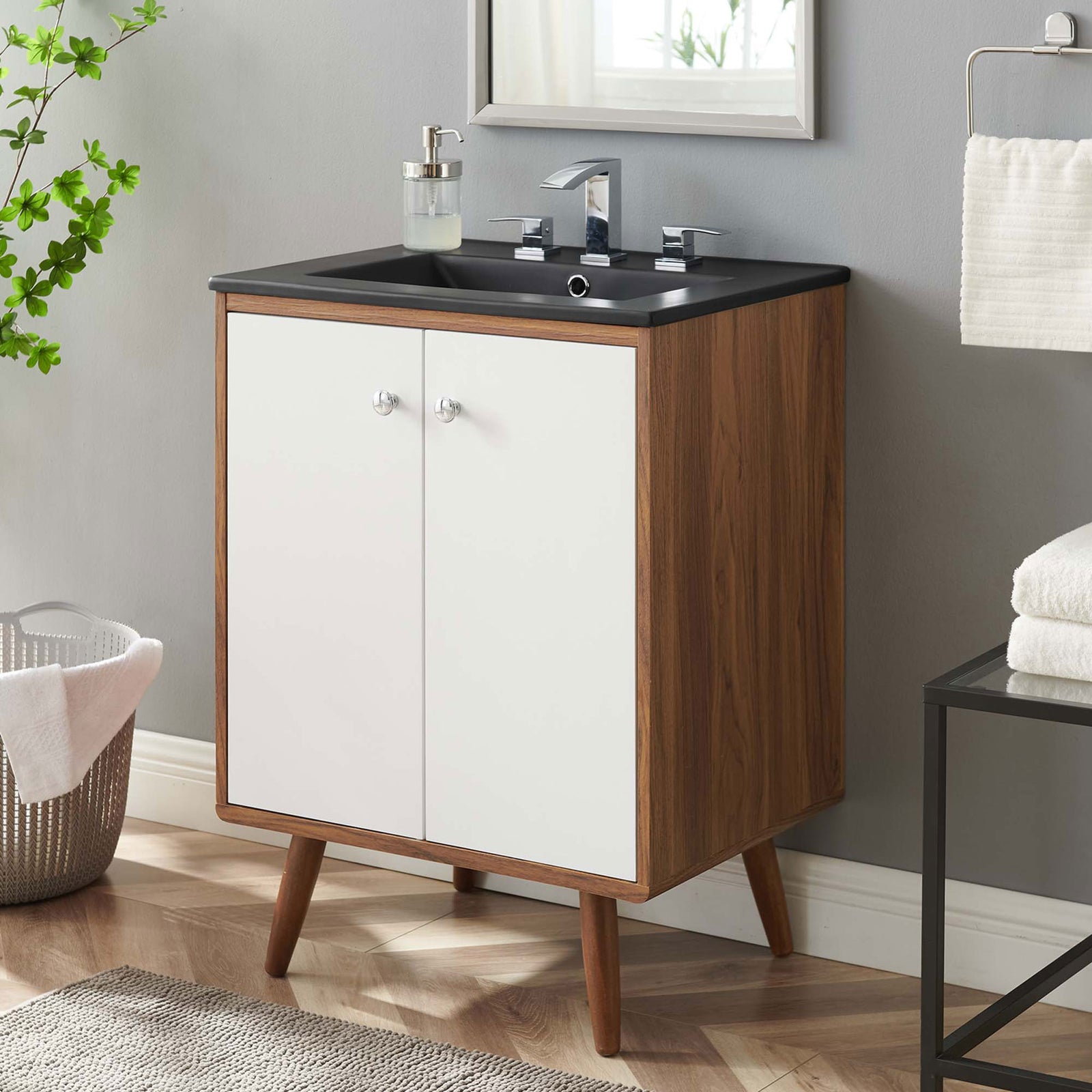 Warm walnut, crisp white doors, and a sleek black top elevate the vanity's mid-century character || EEI-5363-WHI-BLK || front_angle_room