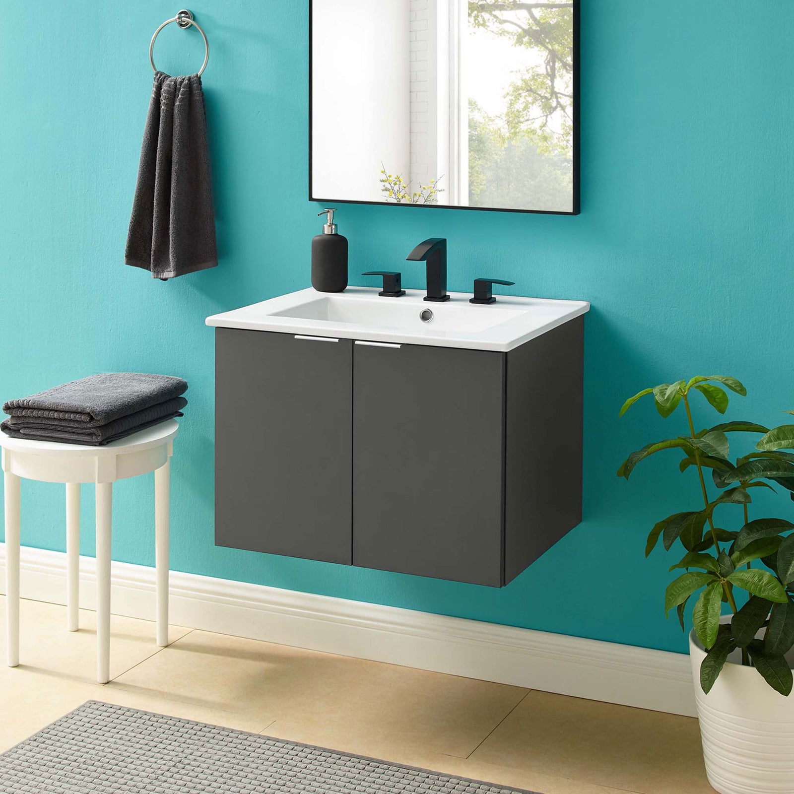 Floating vanity elevates the bath with a gray finish and bright white integrated sink || EEI-5379-GRY-WHI || front_room