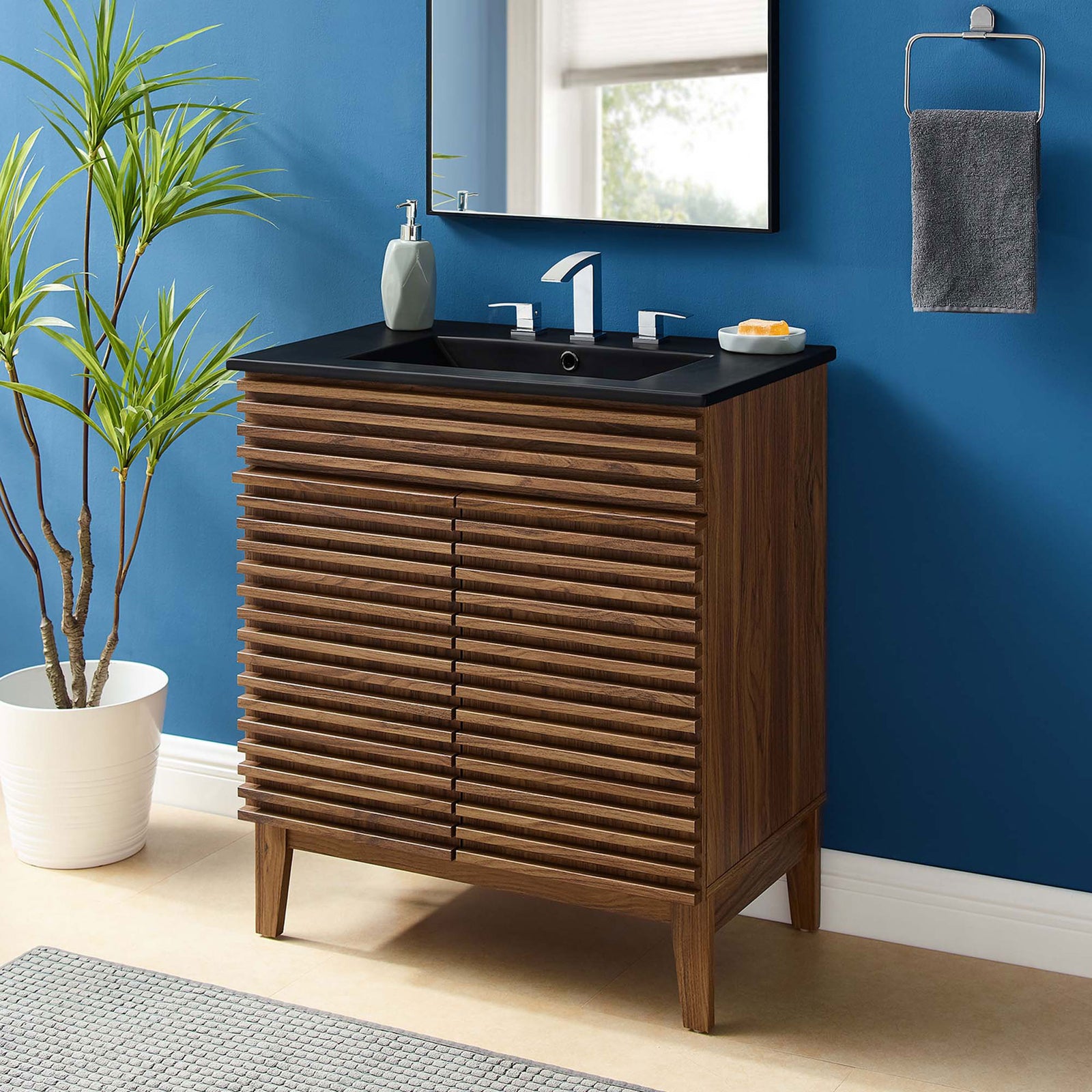 Bright bathroom vignette showcases the walnut vanity with matte black sink || EEI-5418-WAL-BLK || front_angle_room
