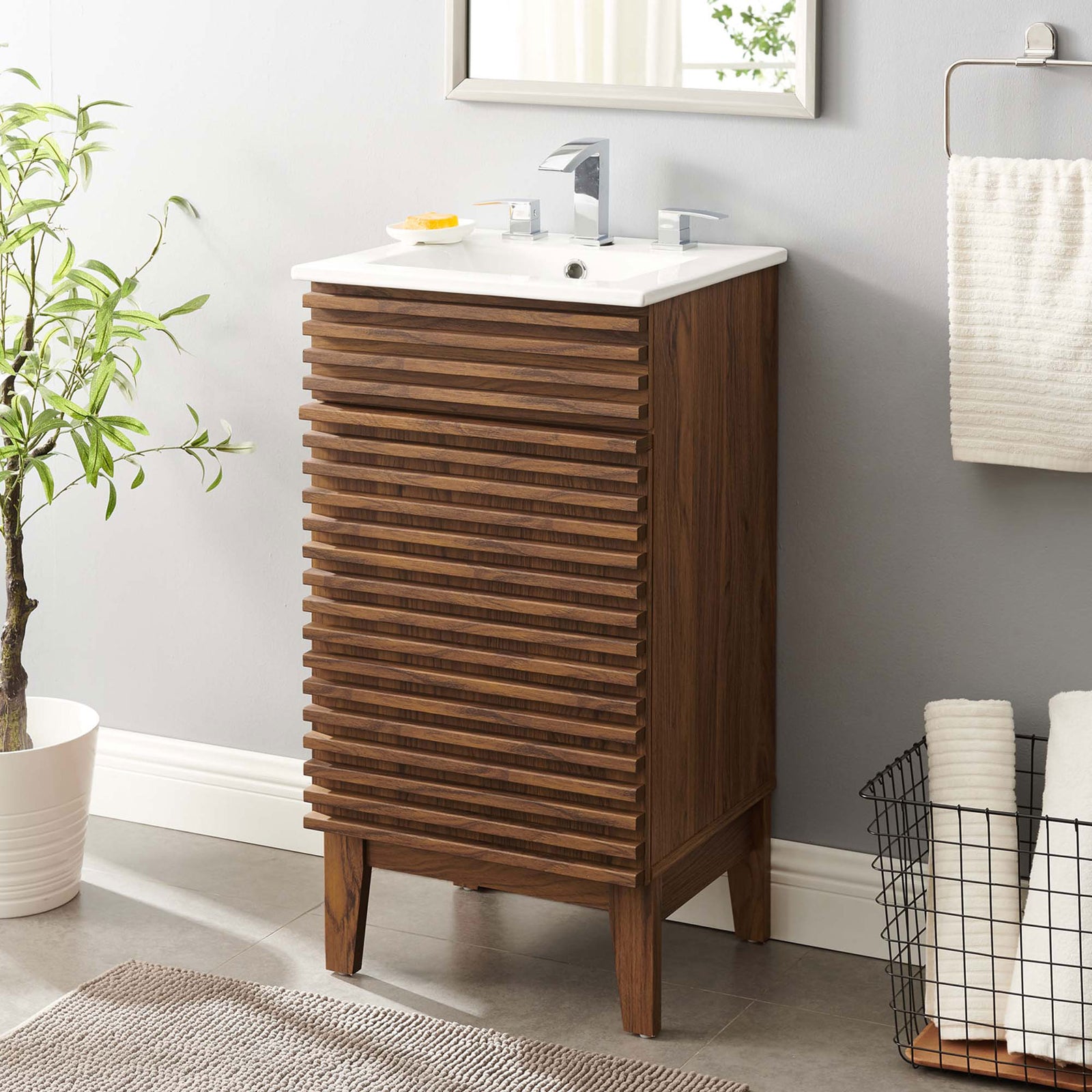 Streamlined vanity brings mid-century charm to the bath with a space-saving footprint. || EEI-5420-WAL-WHI || front_angle_room
